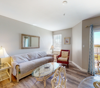 Convenient condo w/ private balcony, beach views, shared pool & AC