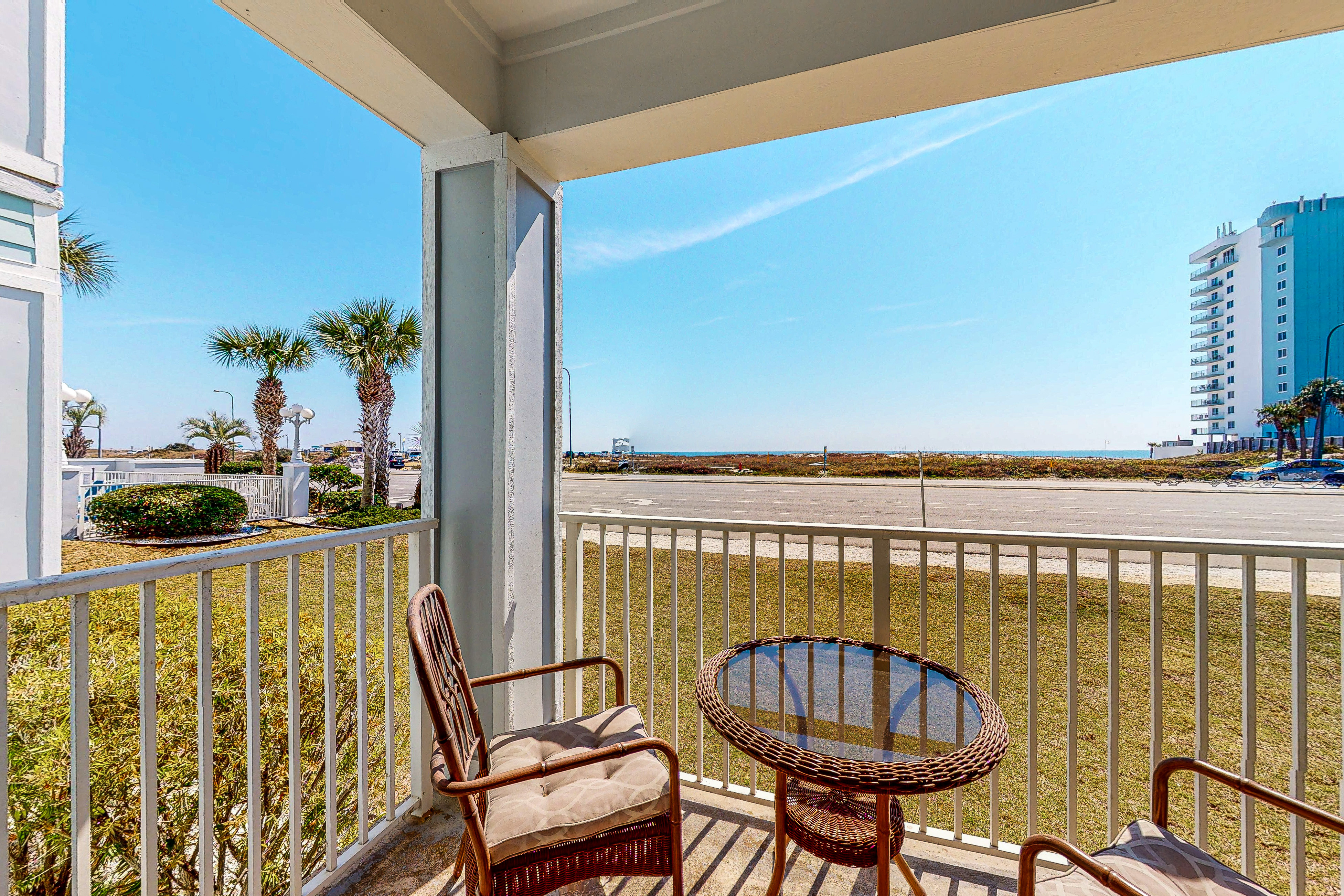 Convenient condo w/ private balcony, beach views, shared pool & AC