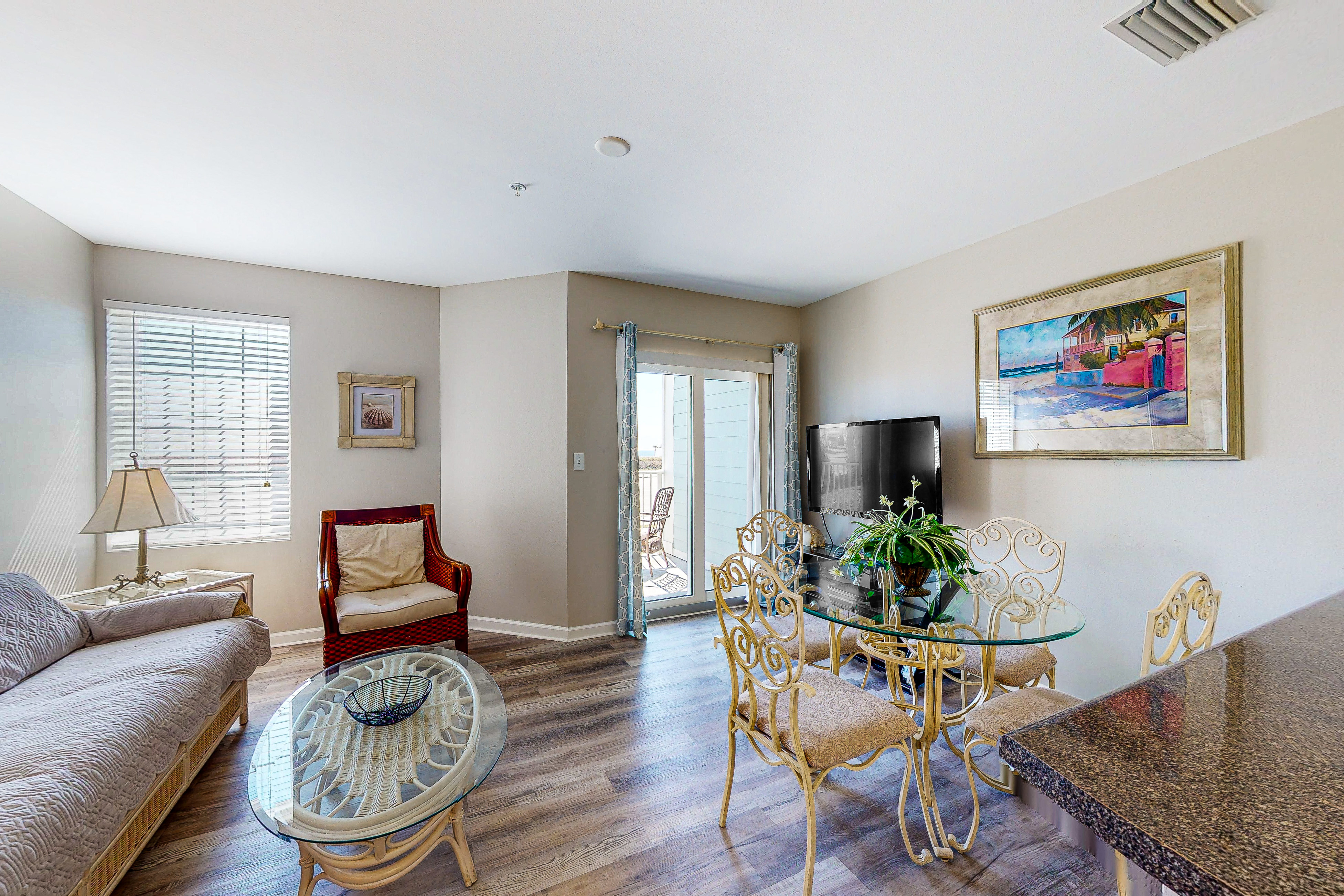 Convenient condo w/ private balcony, beach views, shared pool & AC