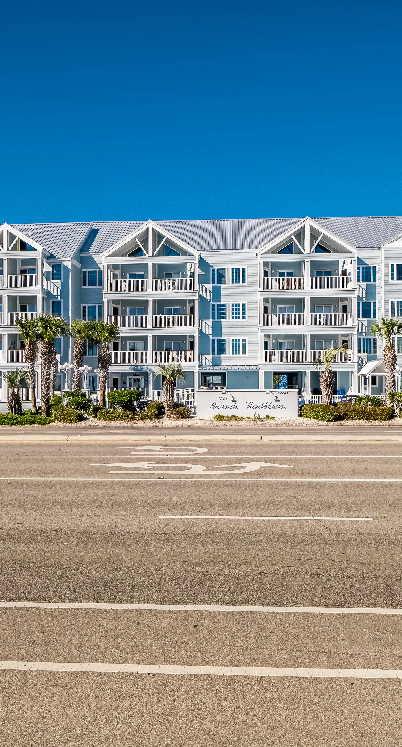 Convenient condo w/ private balcony, beach views, shared pool & AC