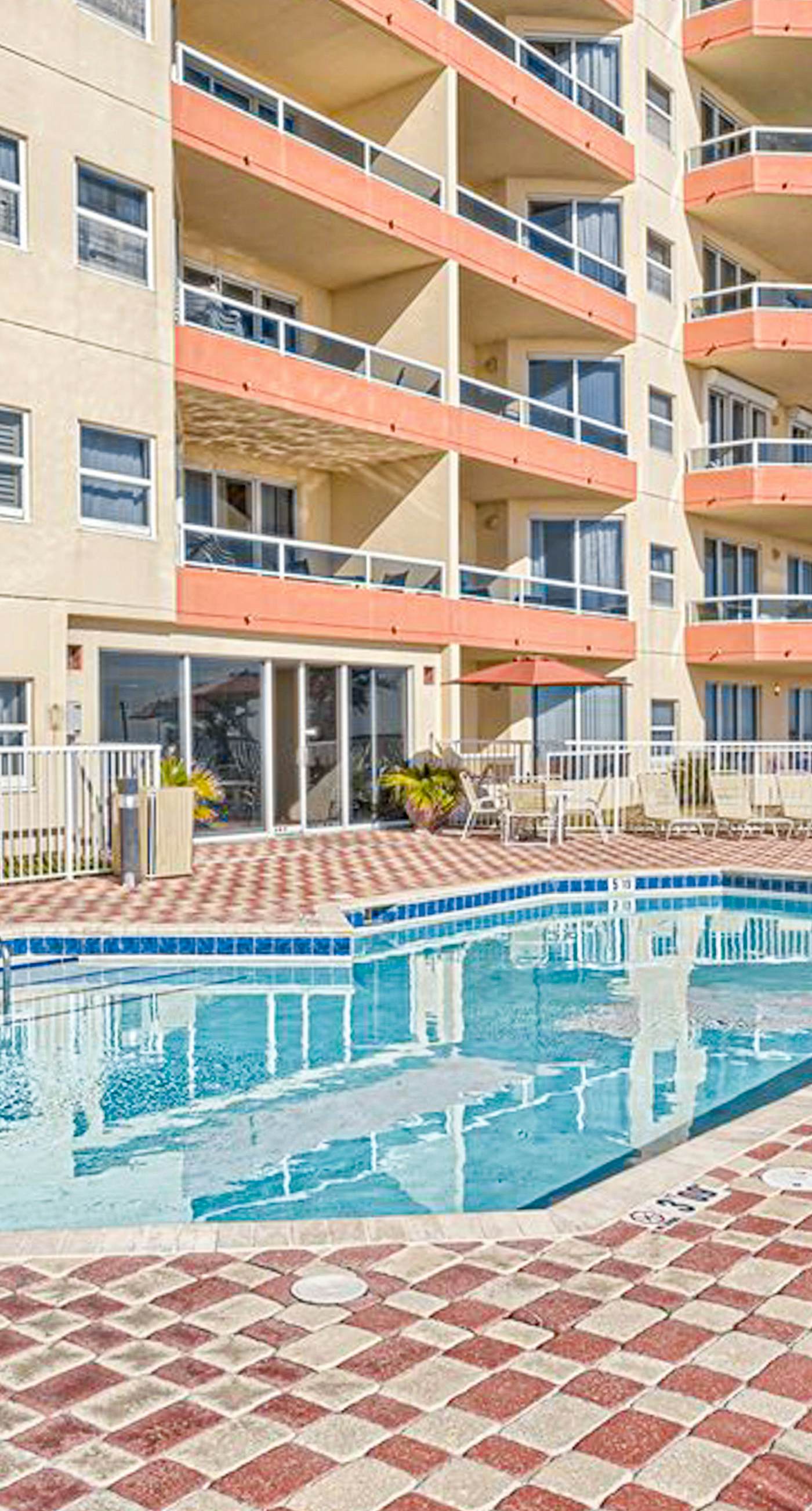 Beachfront resort condo with shared pool, tennis court, free WiFi, central AC