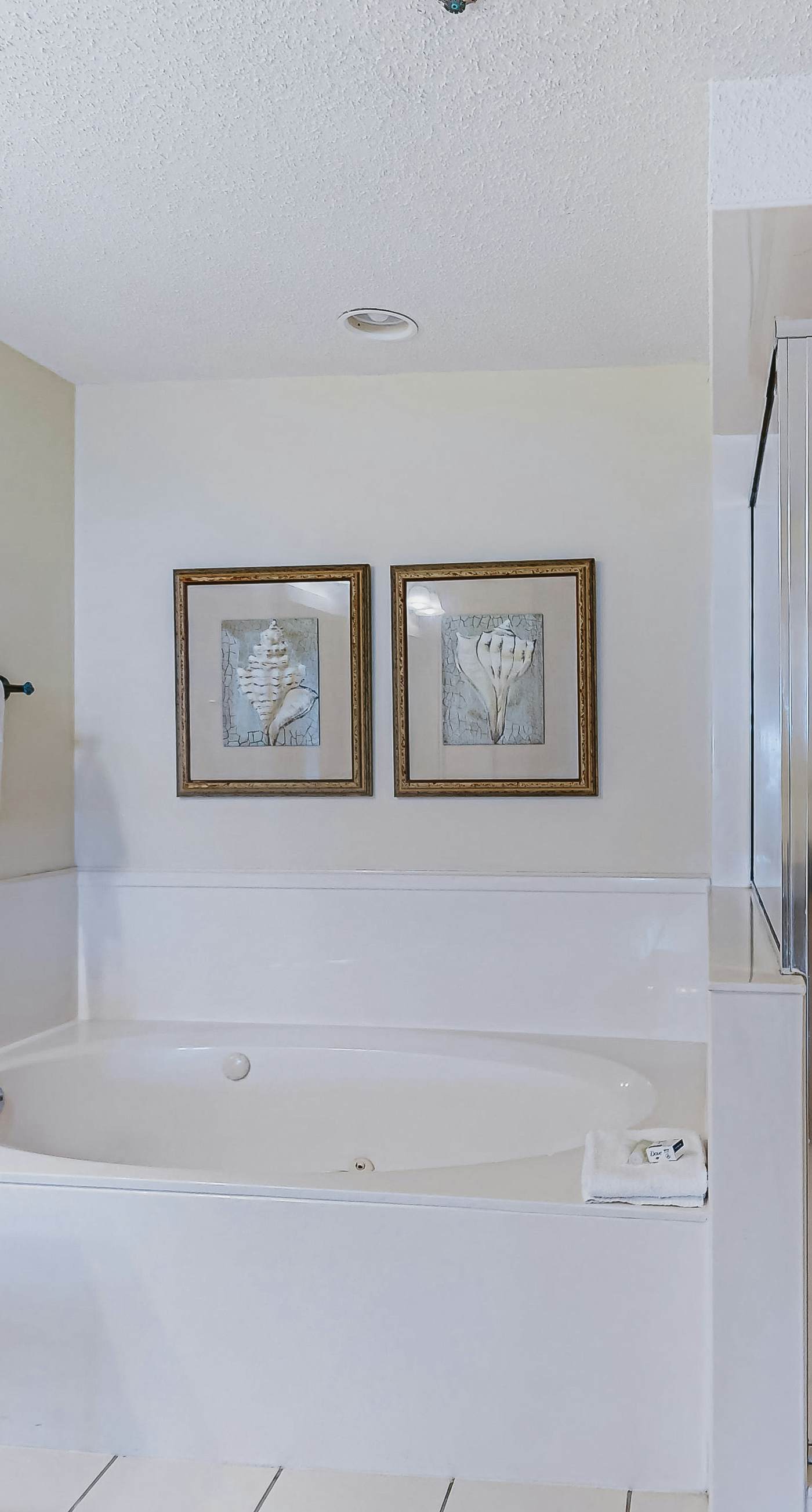 Beachfront resort condo with shared pool, tennis court, free WiFi, central AC