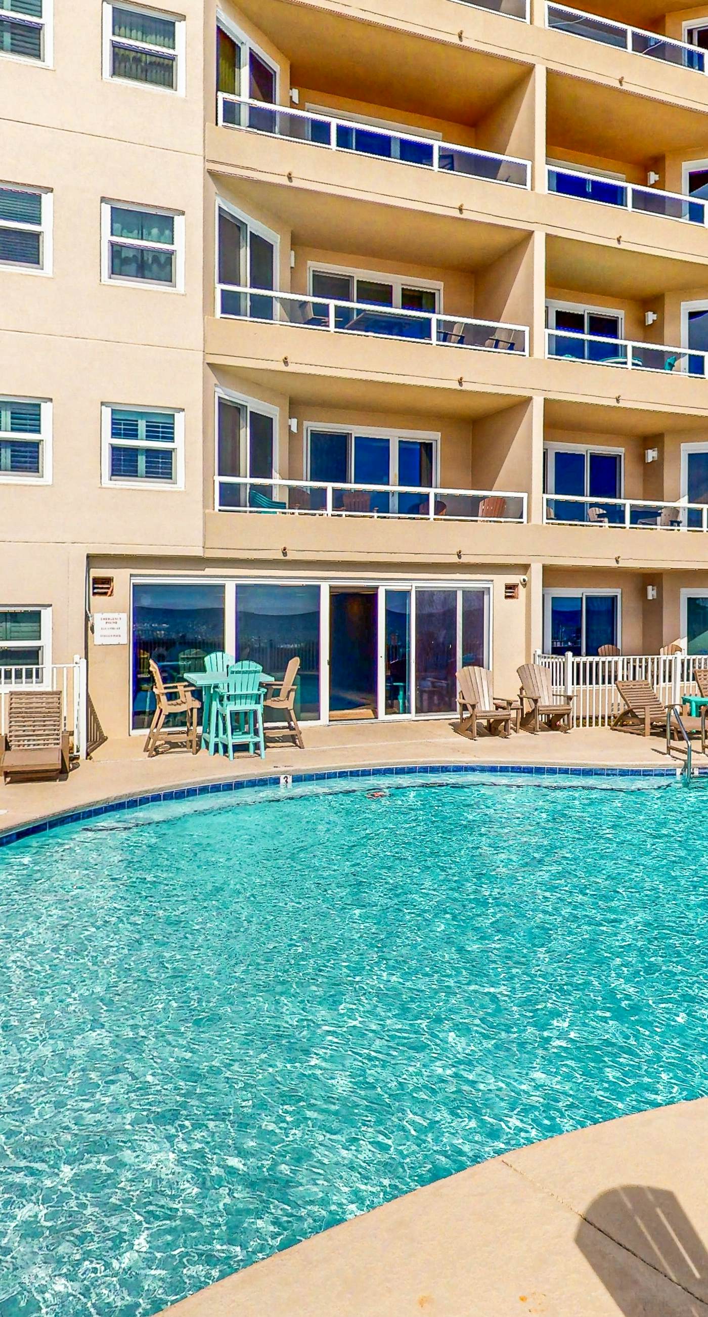 Beachfront resort condo with shared pool, tennis court, free WiFi, central AC