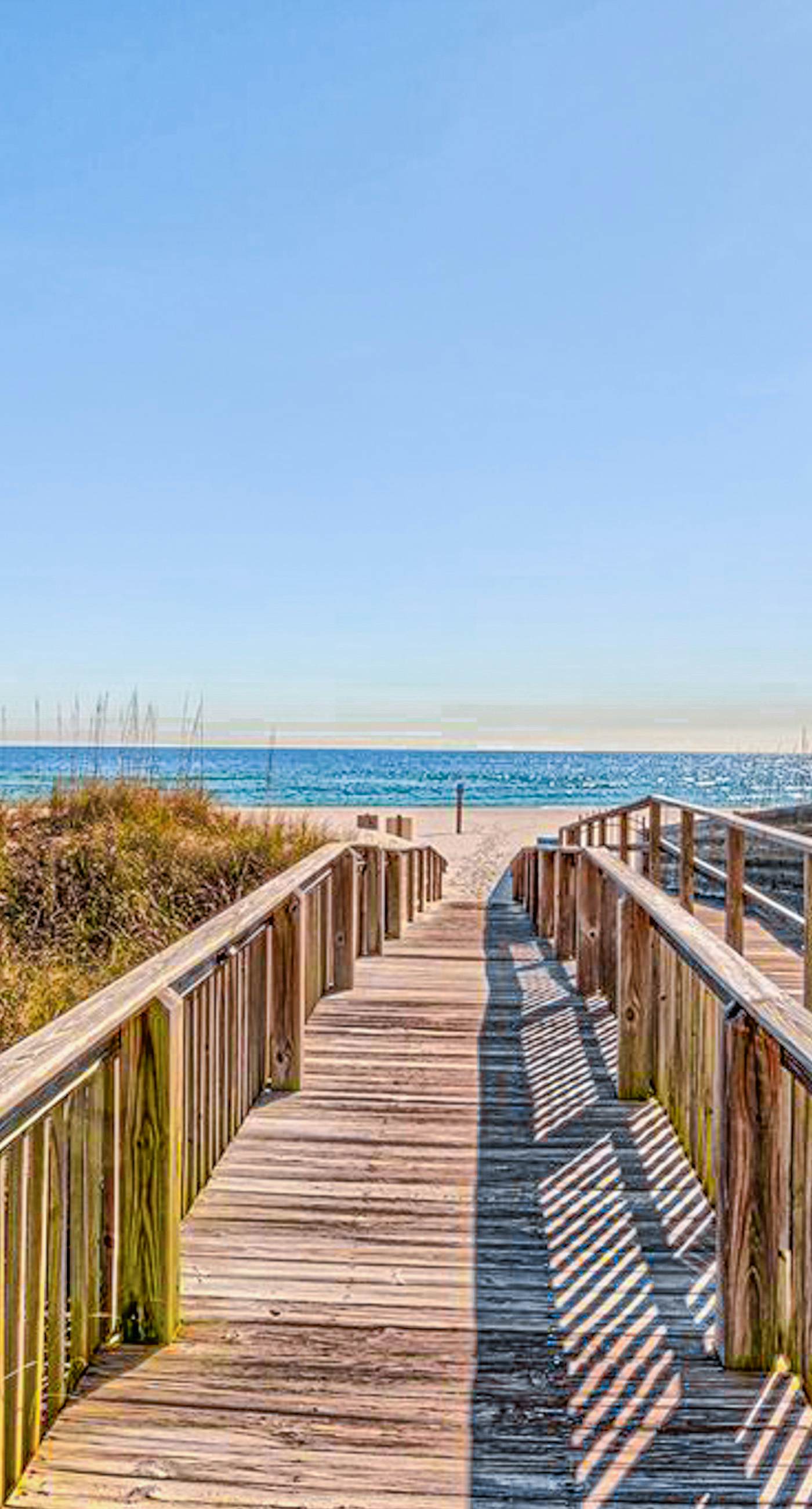 Beachfront resort condo with shared pool, tennis court, free WiFi, central AC