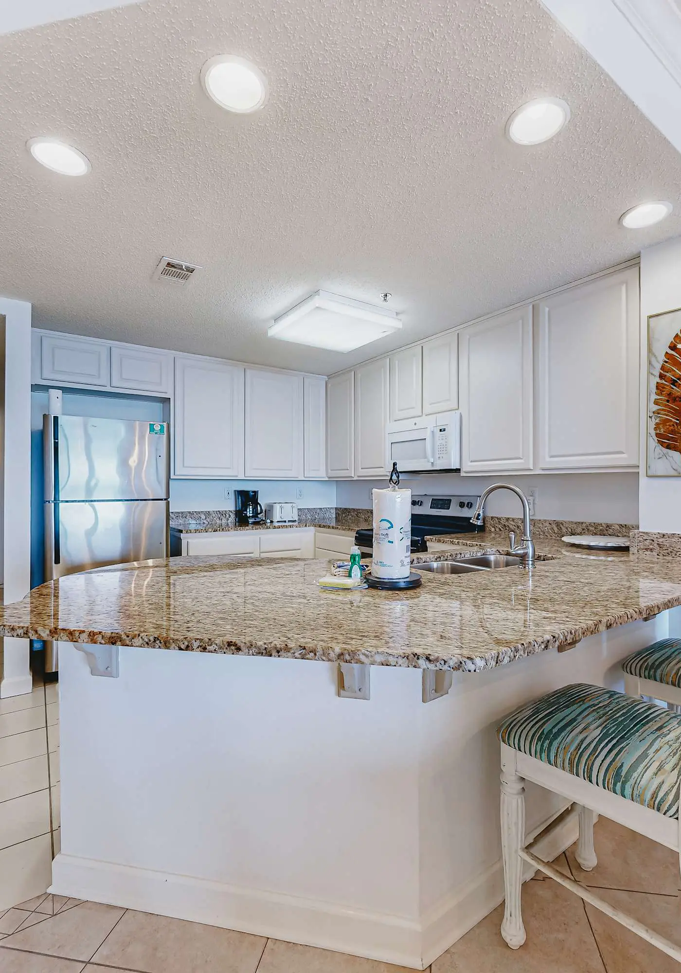 Beachfront resort condo with shared pool, tennis court, free WiFi, central AC