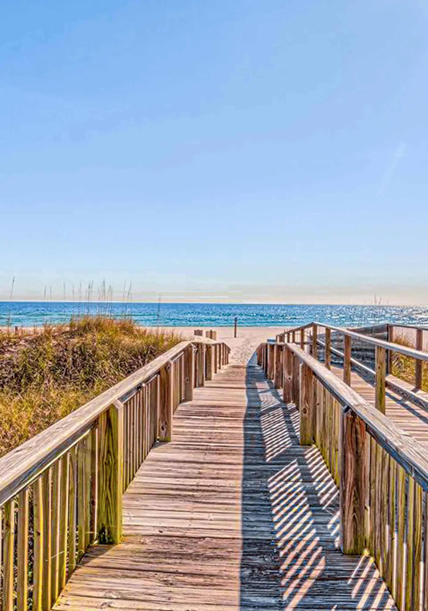 Beachfront resort condo with shared pool, tennis court, free WiFi, central AC