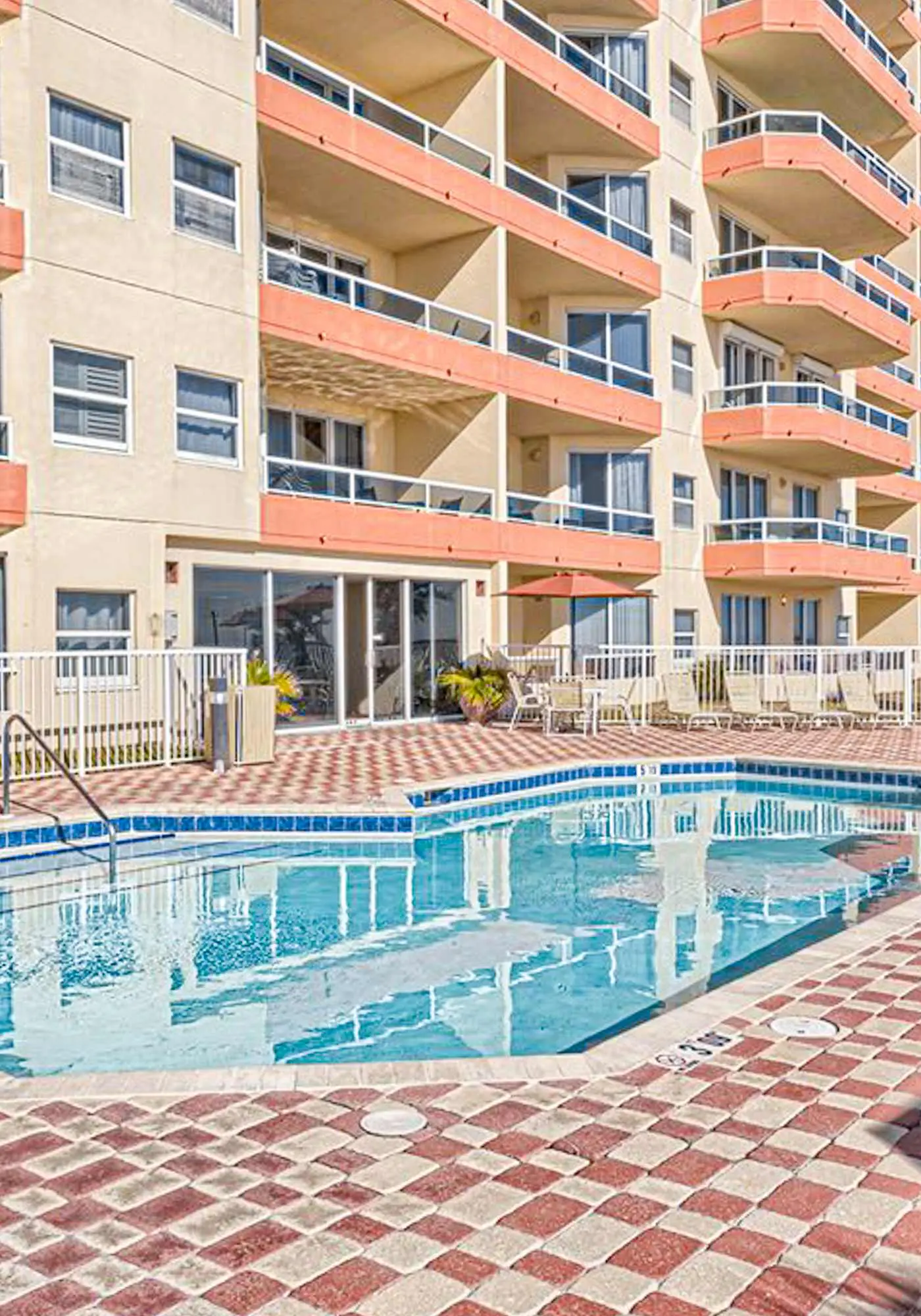 Beachfront resort condo with shared pool, tennis court, free WiFi, central AC