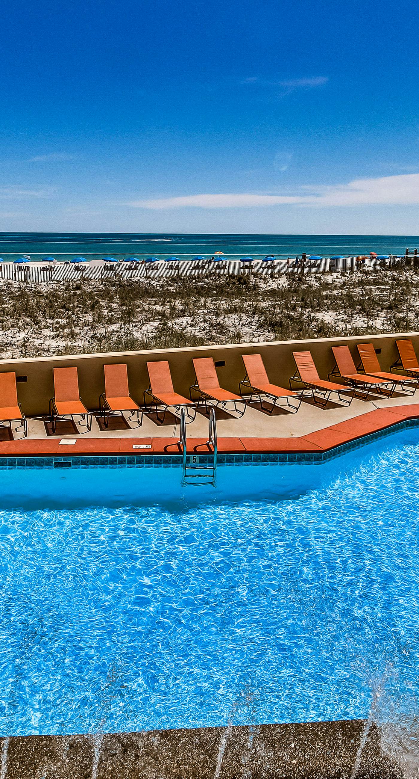 Renovated beachfront condo with balcony, central AC, pool, hot tub & tennis