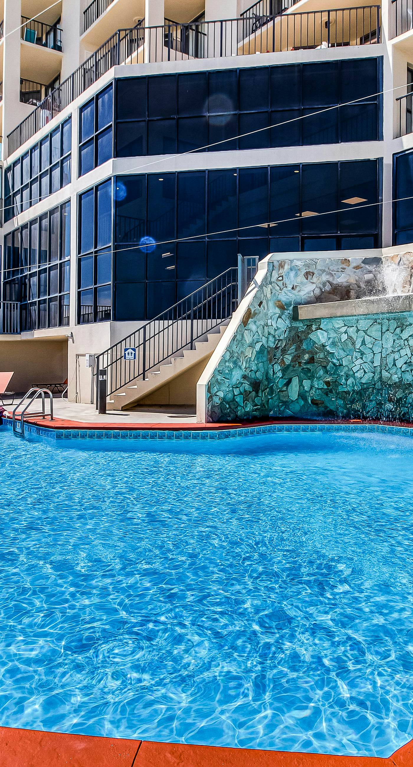 Renovated beachfront condo with balcony, central AC, pool, hot tub & tennis