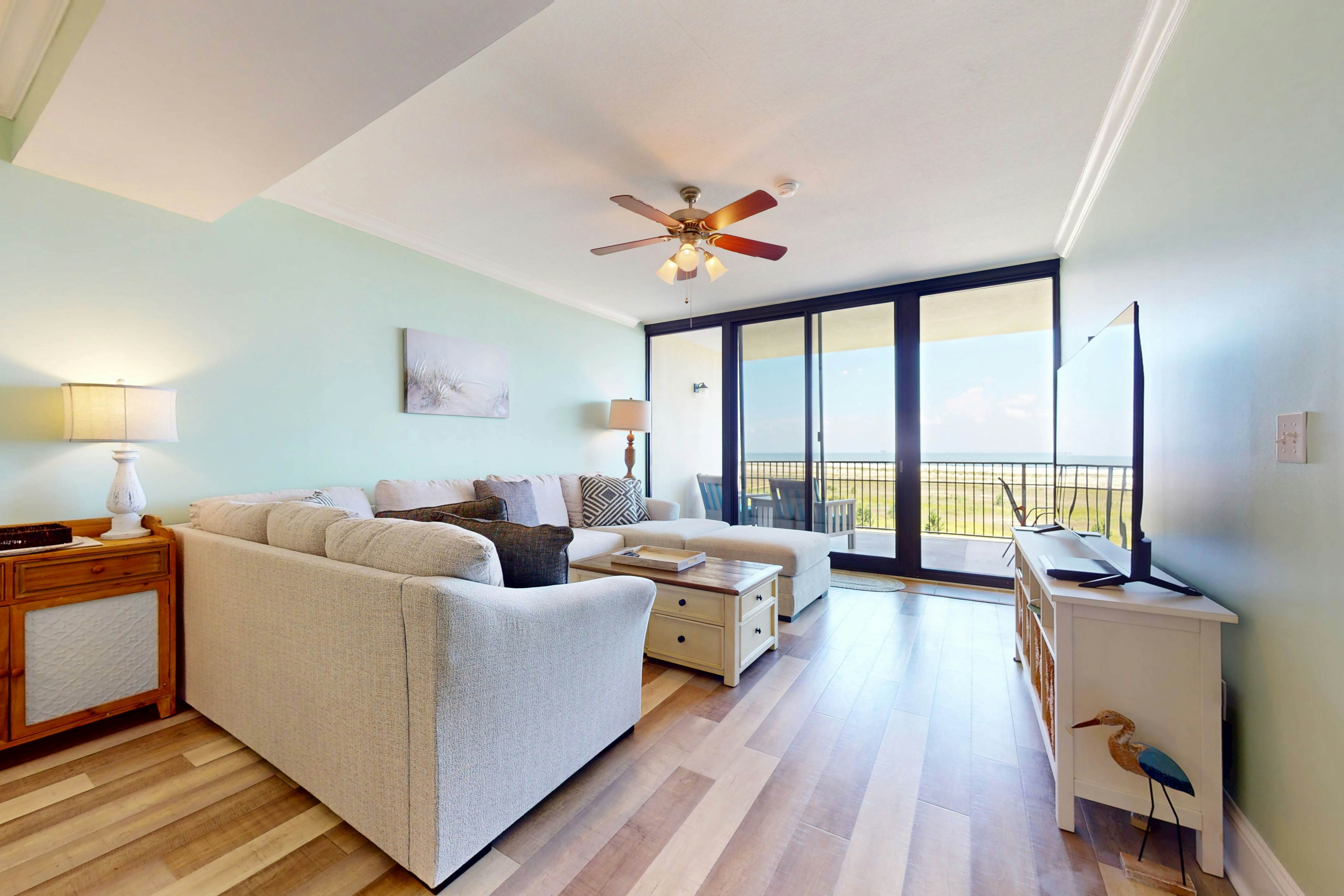 Beachfront condo with pool, private balcony, and laundry