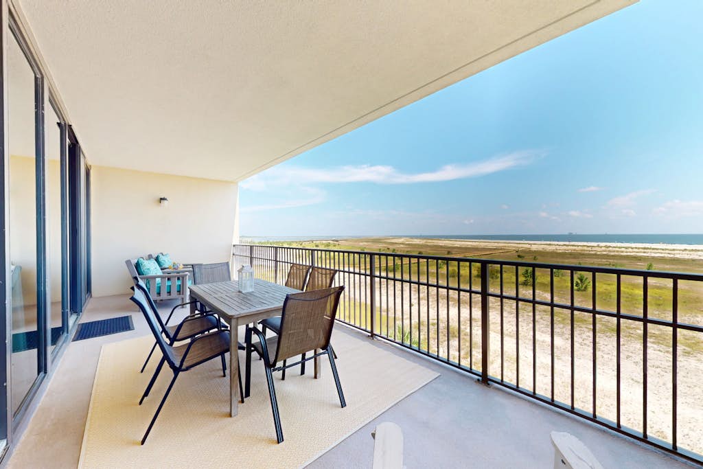 Beachfront condo with pool, private balcony, and laundry