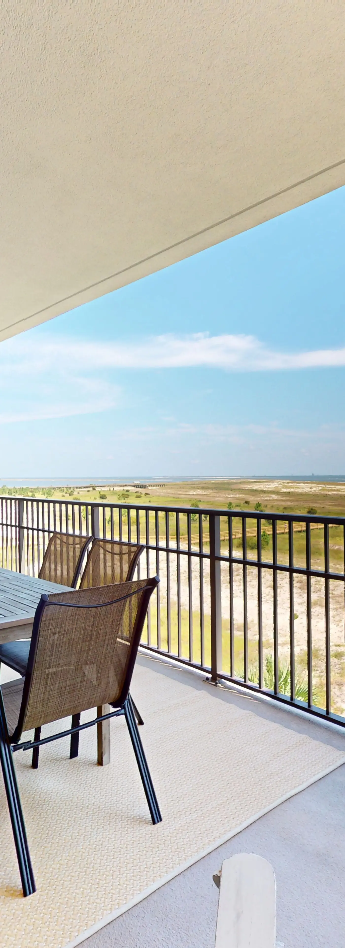 Beachfront condo with pool, private balcony, and laundry