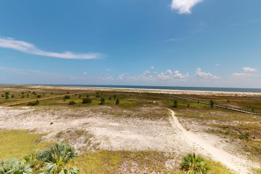 Beachfront condo with pool, private balcony, and laundry