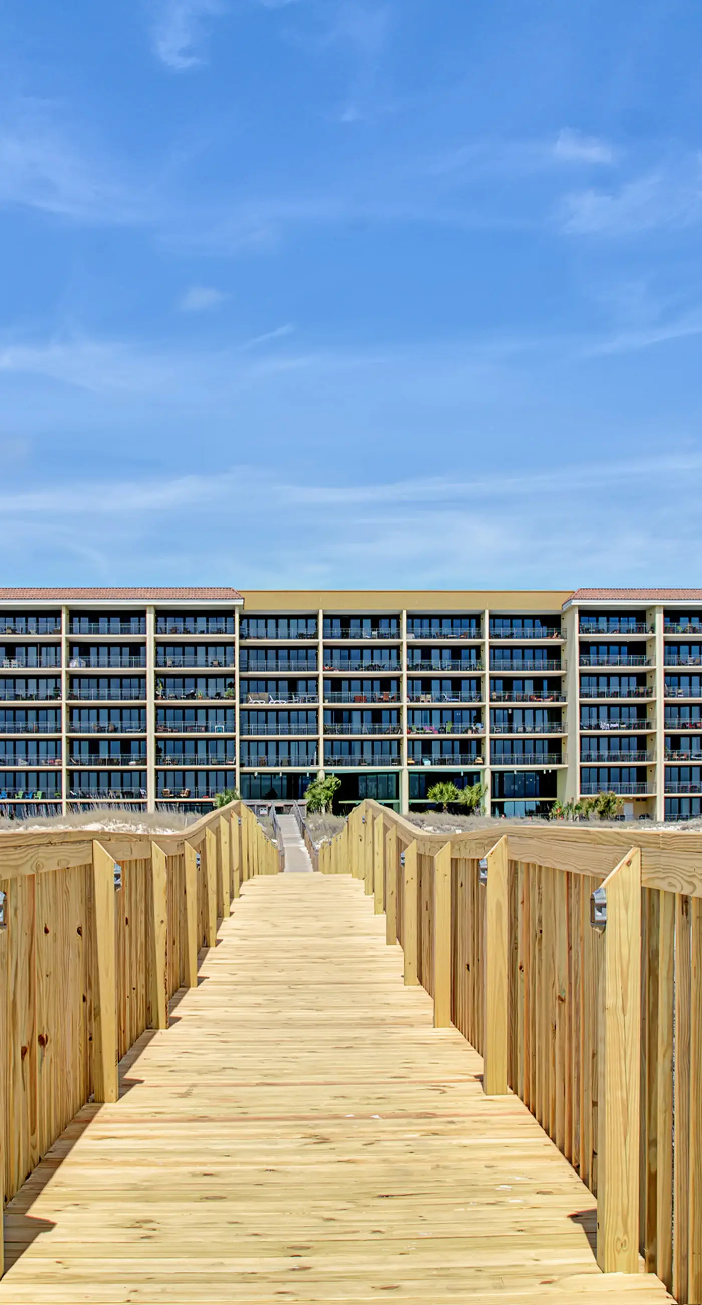 Beachfront condo with pool, private balcony, and laundry