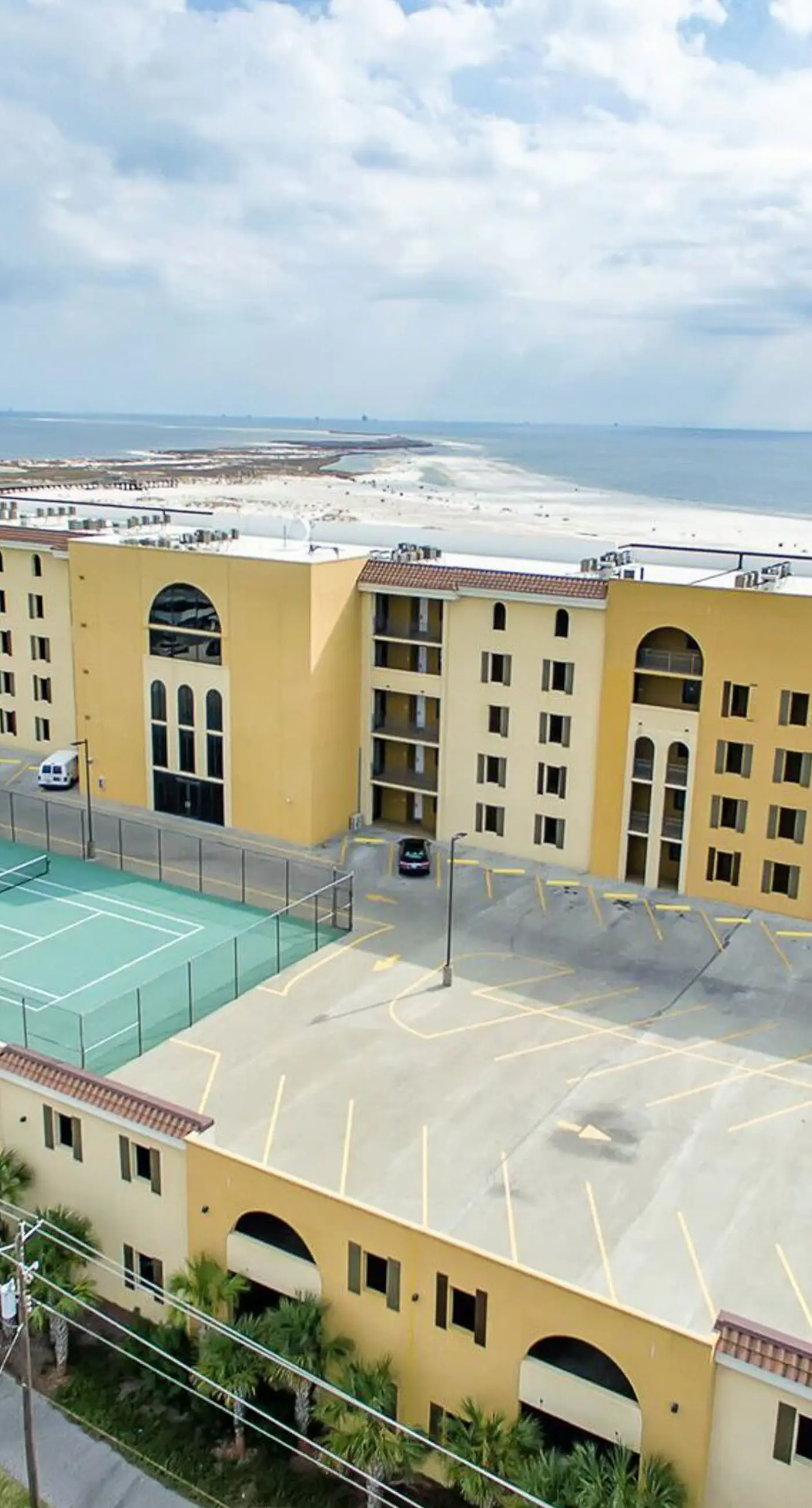 Beachfront condo with pool, private balcony, and laundry