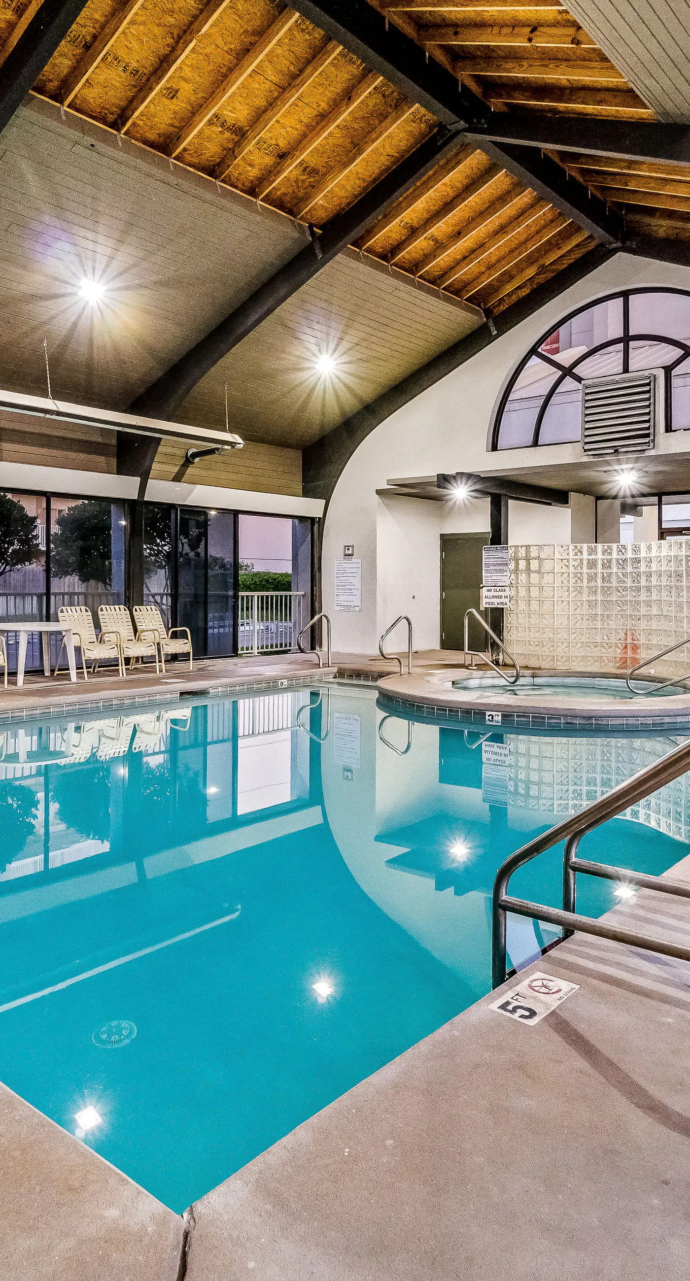 Waterfront oasis with direct beach access, pool, hot tub, & gym