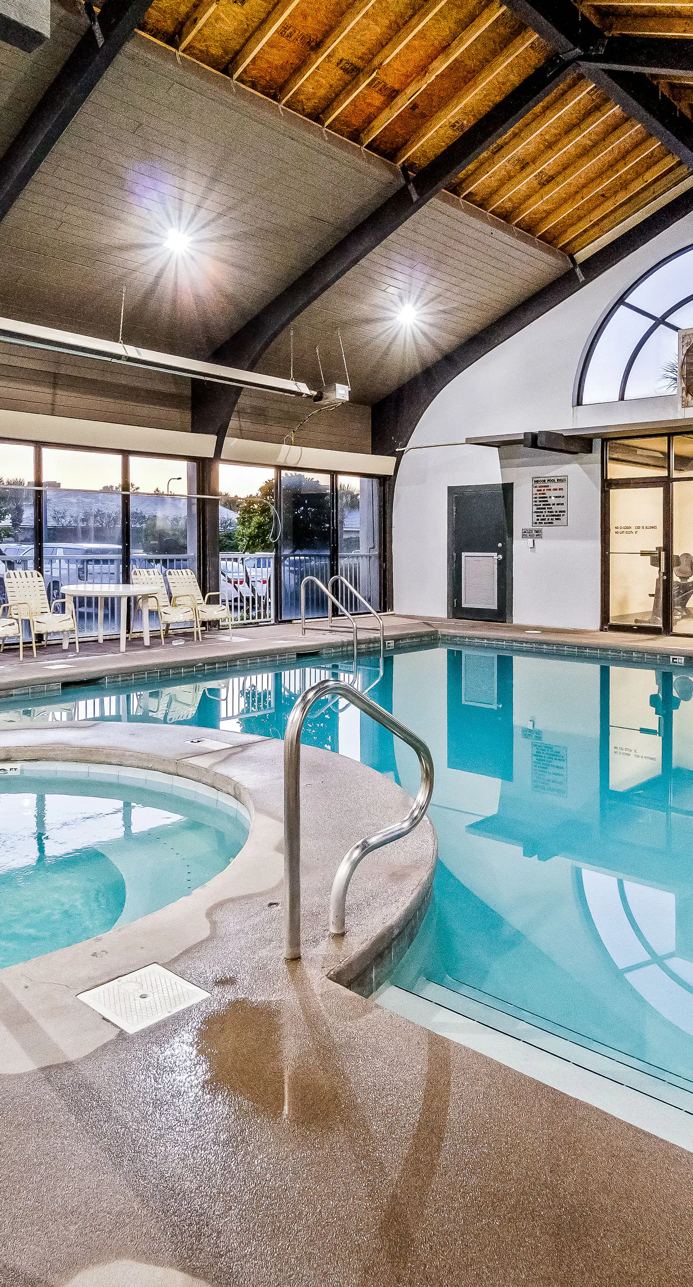 Waterfront oasis with direct beach access, pool, hot tub, & gym