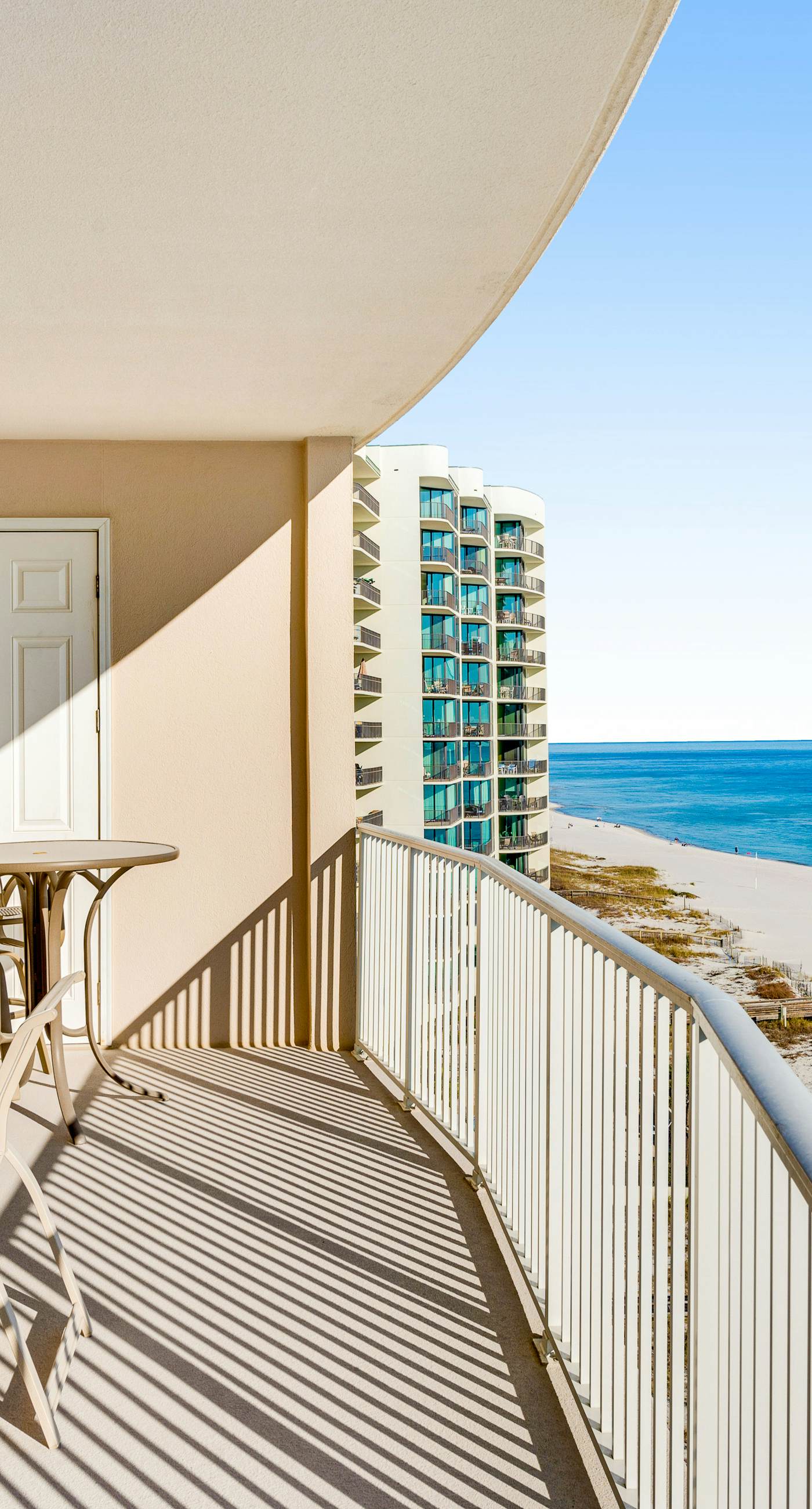 Gulf-front condo with balcony, central AC, pools, hot tubs & beach access