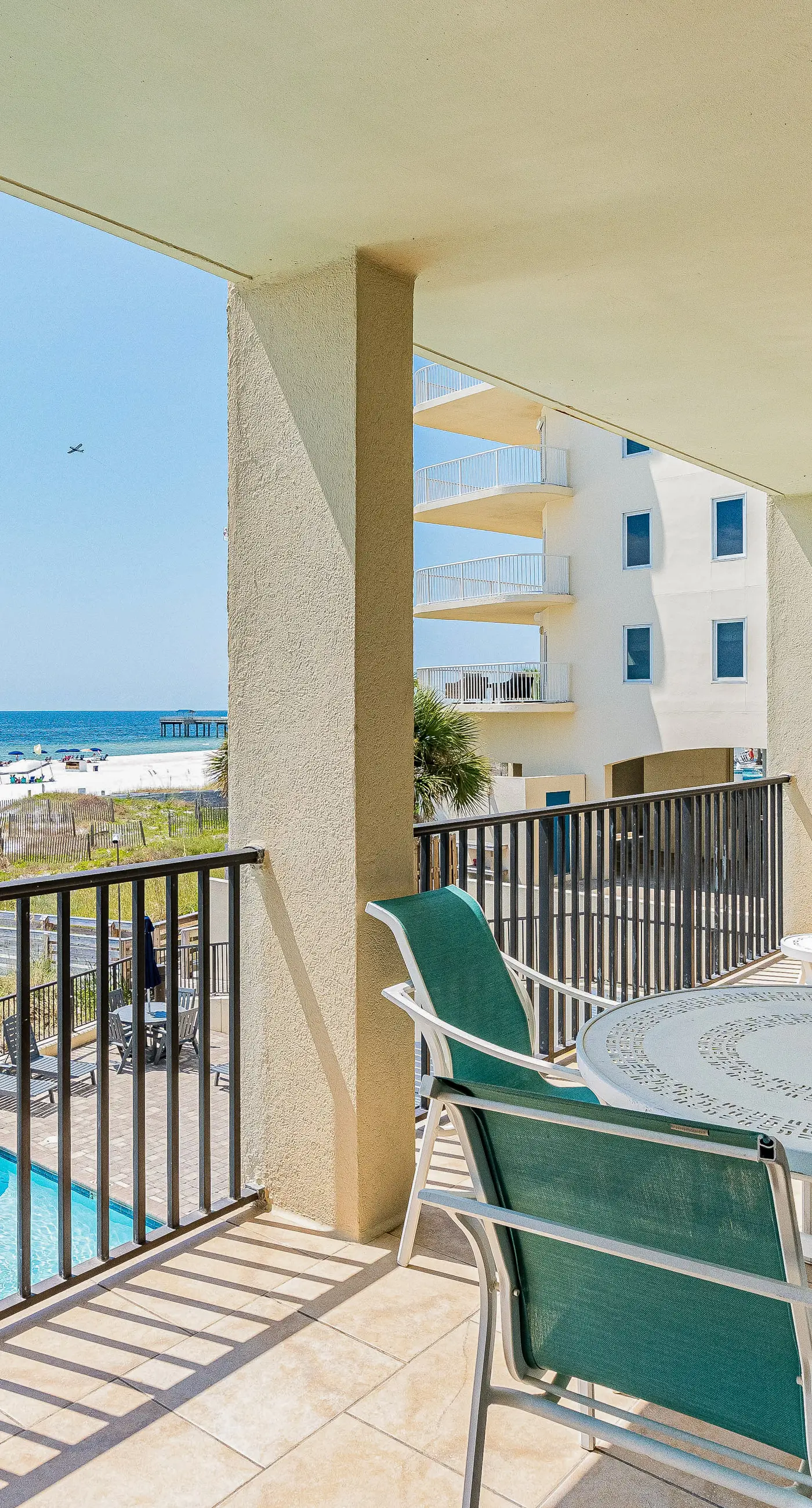 Gulf-front condo with spacious balcony, resort amenities, and cheerful interior