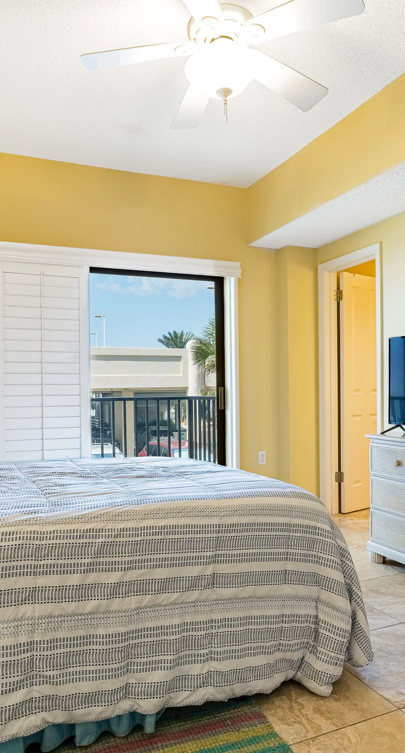 Gulf-front condo with spacious balcony, resort amenities, and cheerful interior