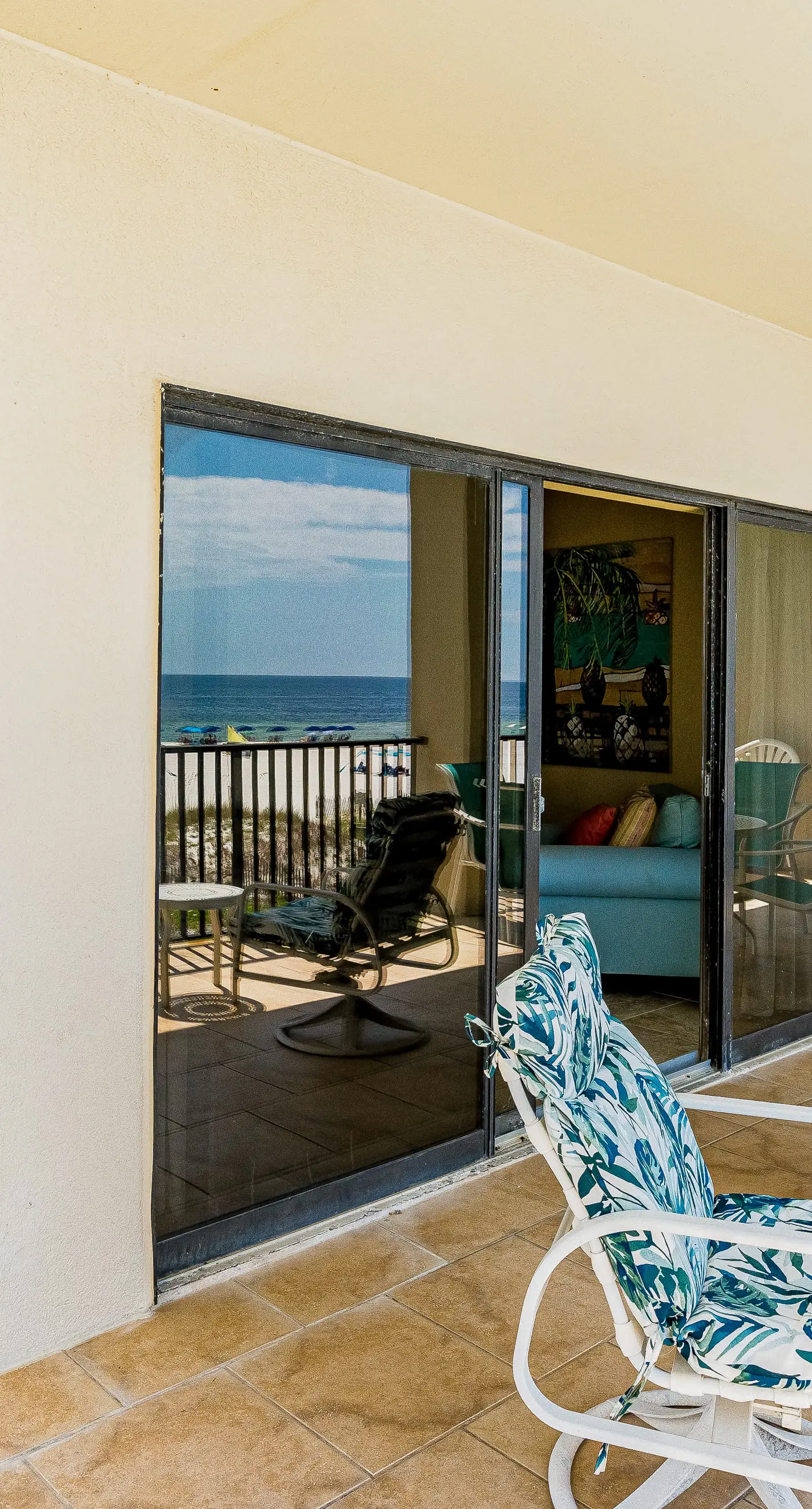 Gulf-front condo with spacious balcony, resort amenities, and cheerful interior