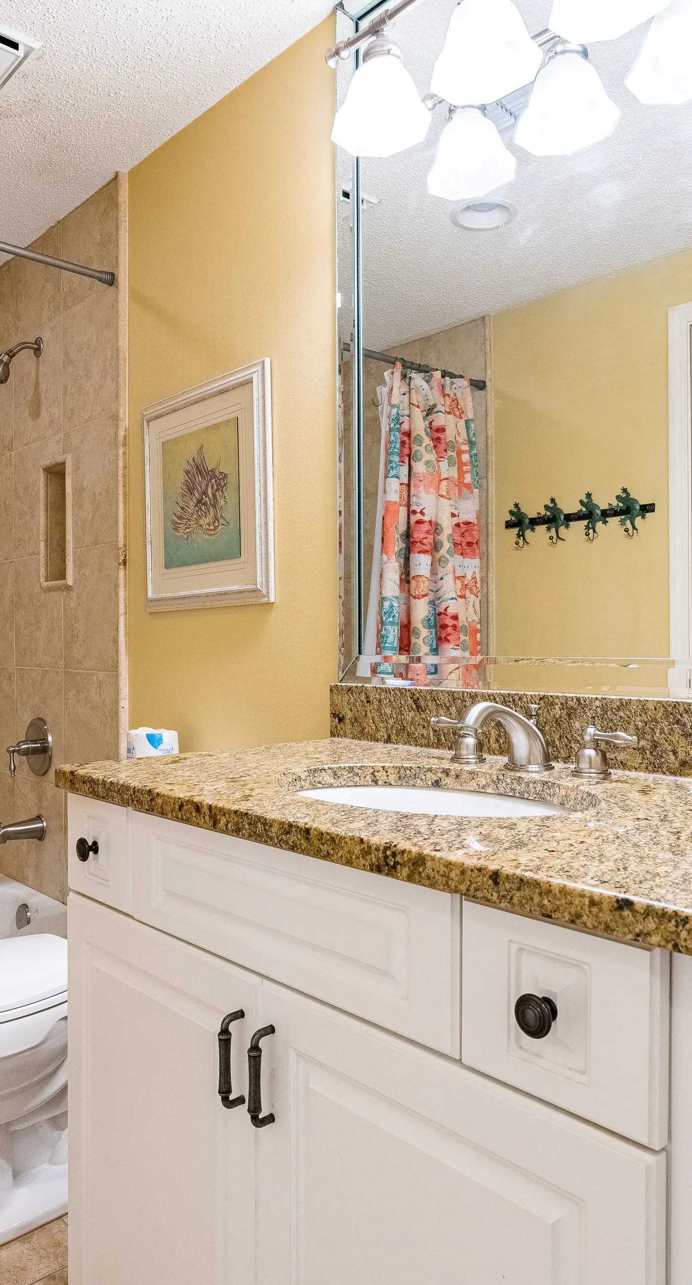 Gulf-front condo with spacious balcony, resort amenities, and cheerful interior