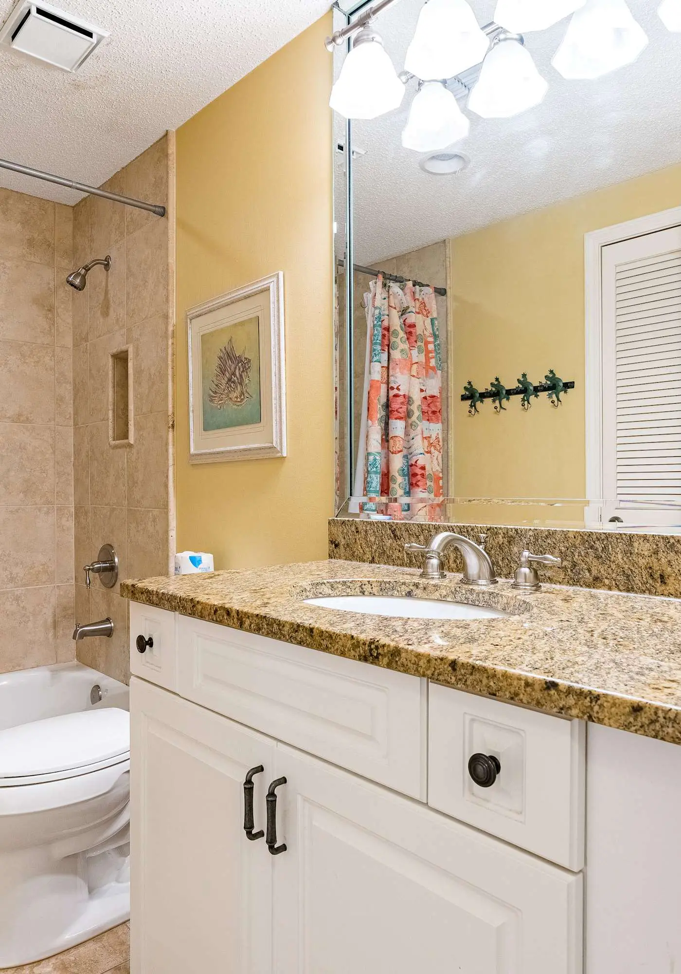 Gulf-front condo with spacious balcony, resort amenities, and cheerful interior