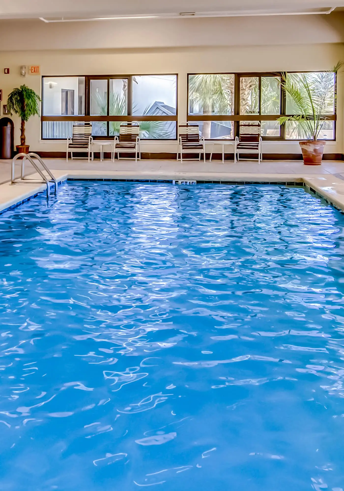 Gulf-front condo with spacious balcony, resort amenities, and cheerful interior