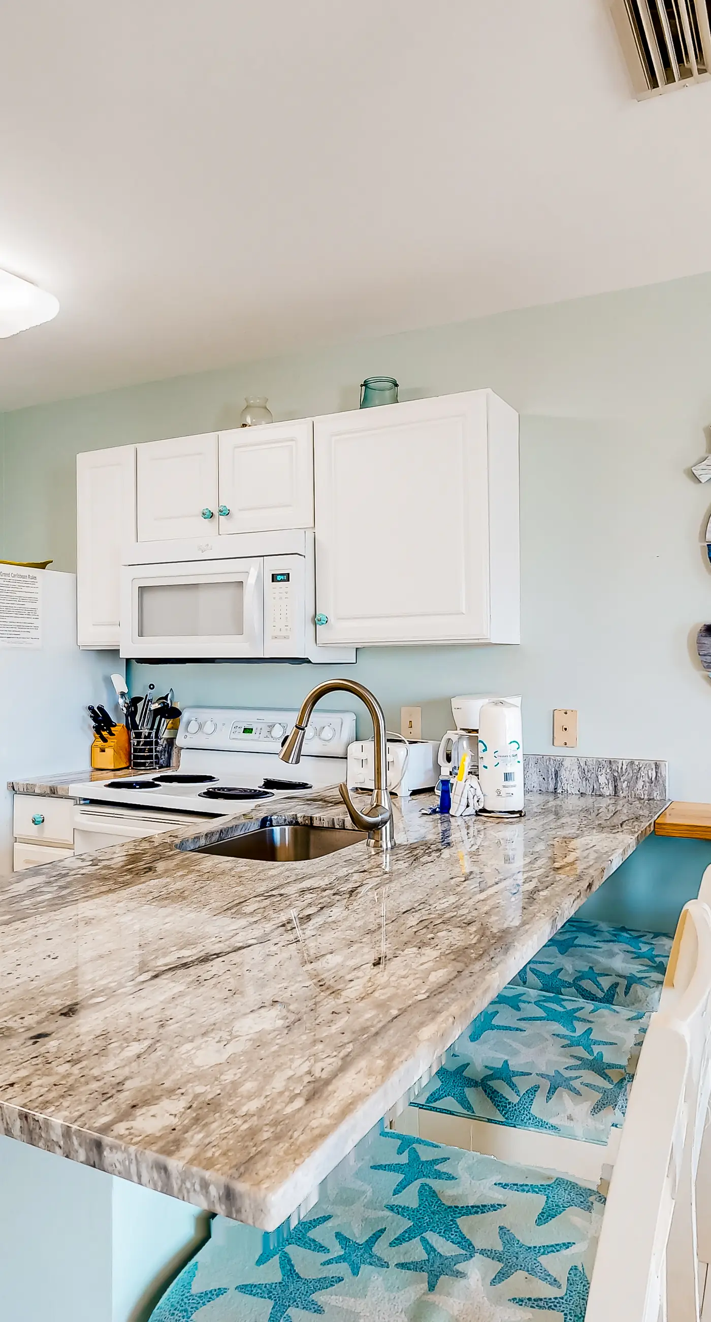 Gulf view condo with pool & fitness center - balcony, open layout, and W/D