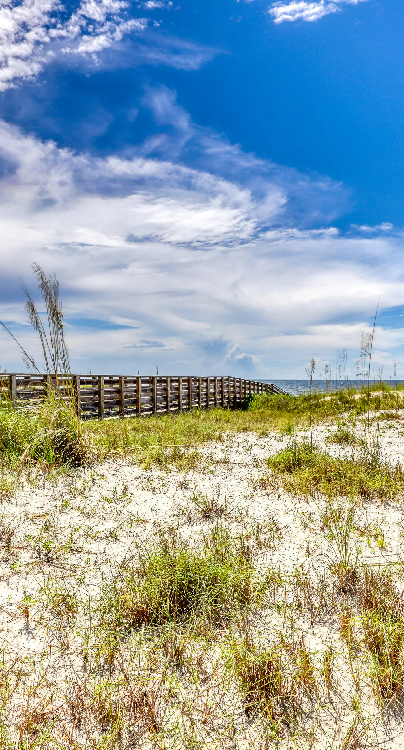 Gulf view condo with pool & fitness center - balcony, open layout, and W/D