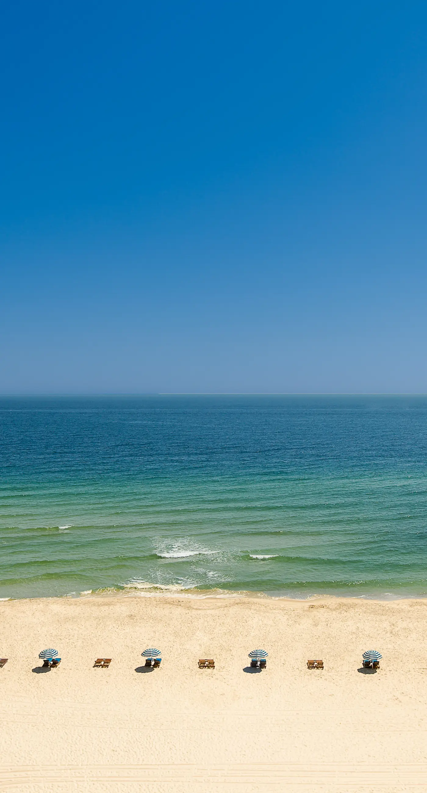 Upscale beachfront retreat w/private balcony, resort pool, sauna, & beach access