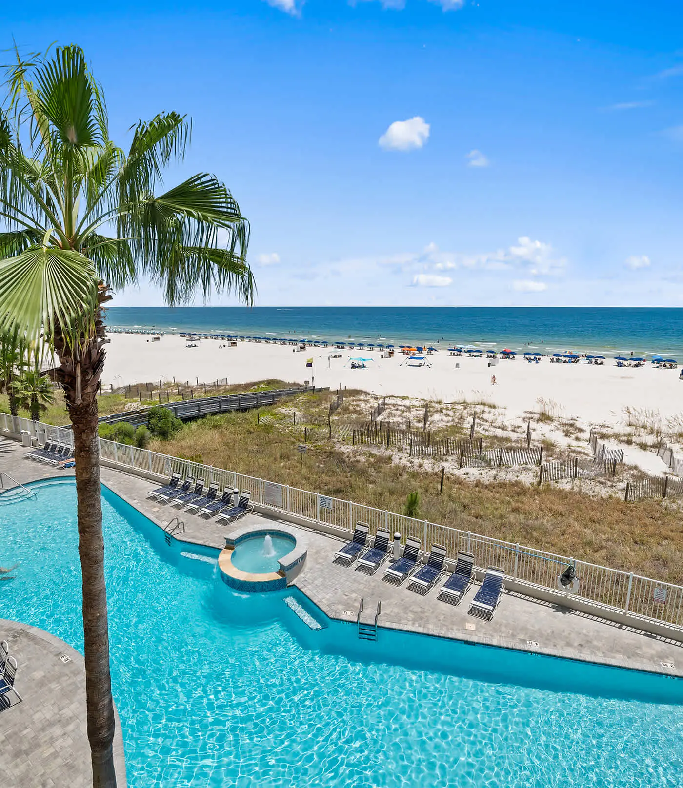 Upscale beachfront retreat w/private balcony, resort pool, sauna, & beach access