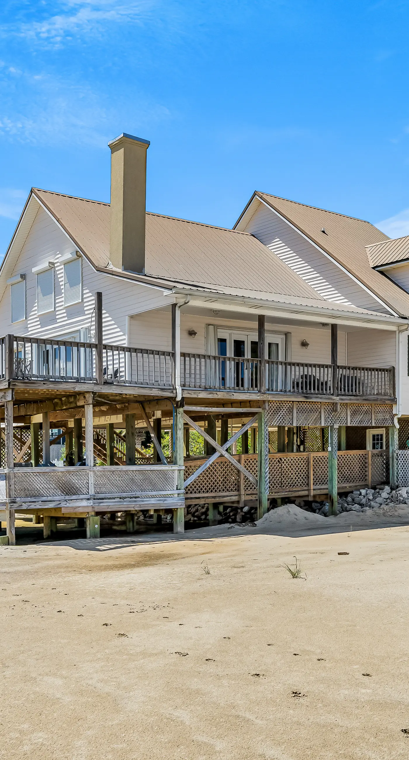 Dog-friendly beach house w/ stunning water views, wrap-around decks & a loft