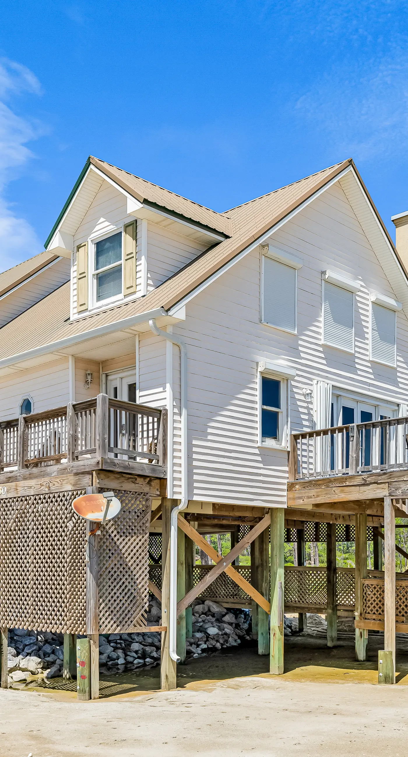 Dog-friendly beach house w/ stunning water views, wrap-around decks & a loft