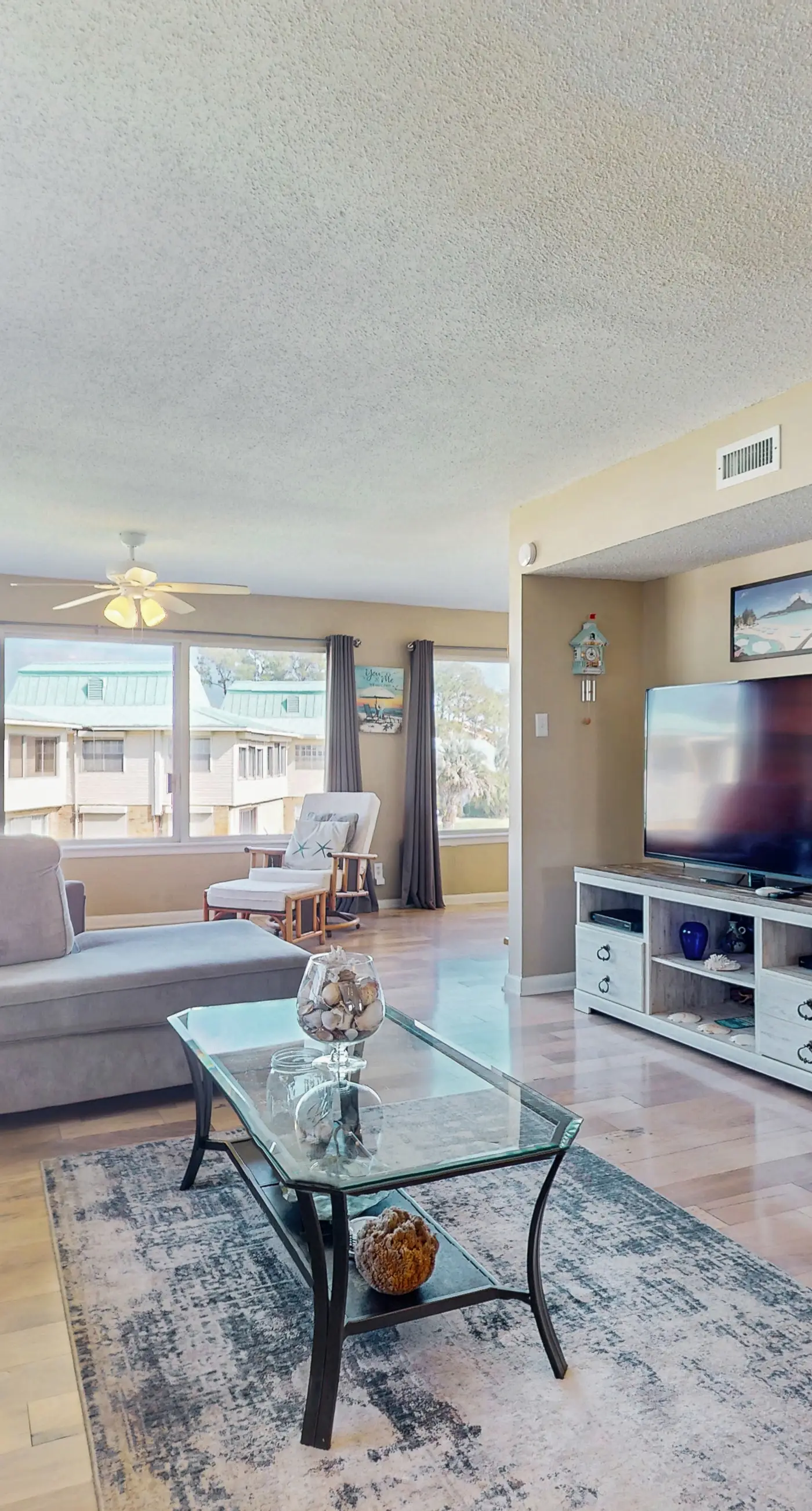 Family-friendly, beachfront getaway with a stainless kitchen & shared pool