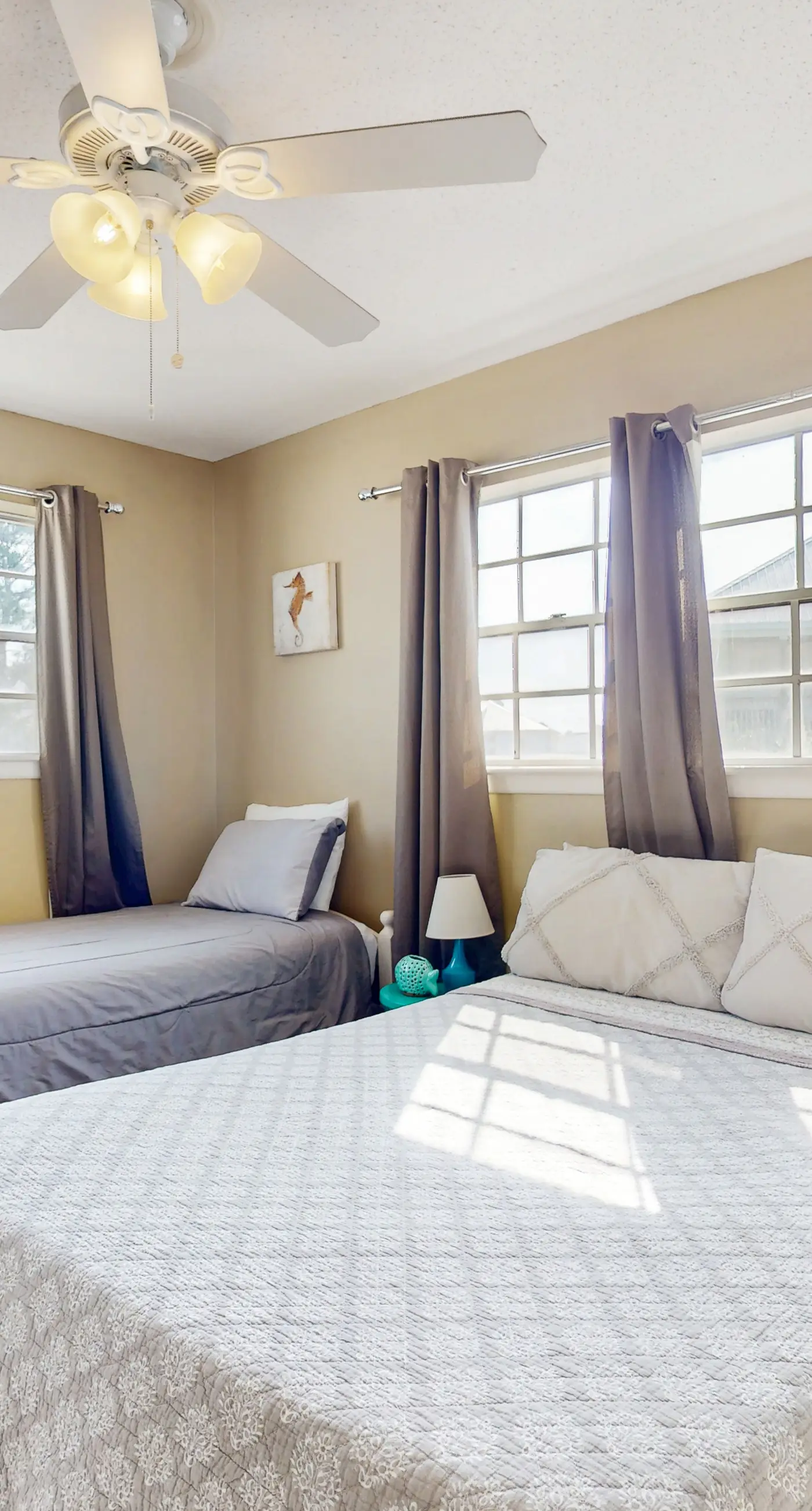 Family-friendly, beachfront getaway with a stainless kitchen & shared pool