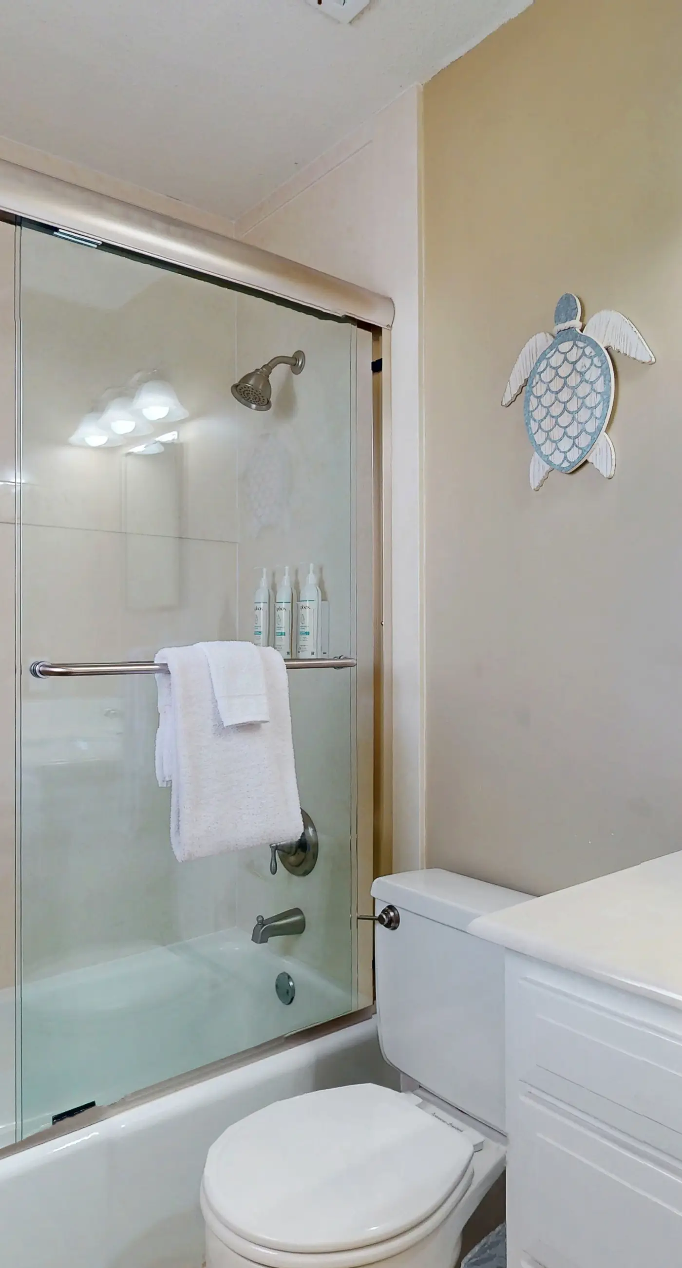 Family-friendly, beachfront getaway with a stainless kitchen & shared pool