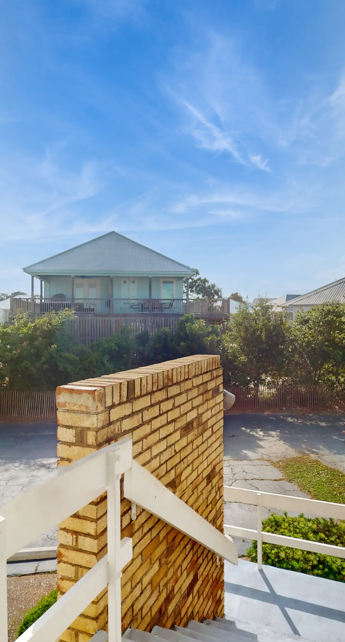Family-friendly, beachfront getaway with a stainless kitchen & shared pool