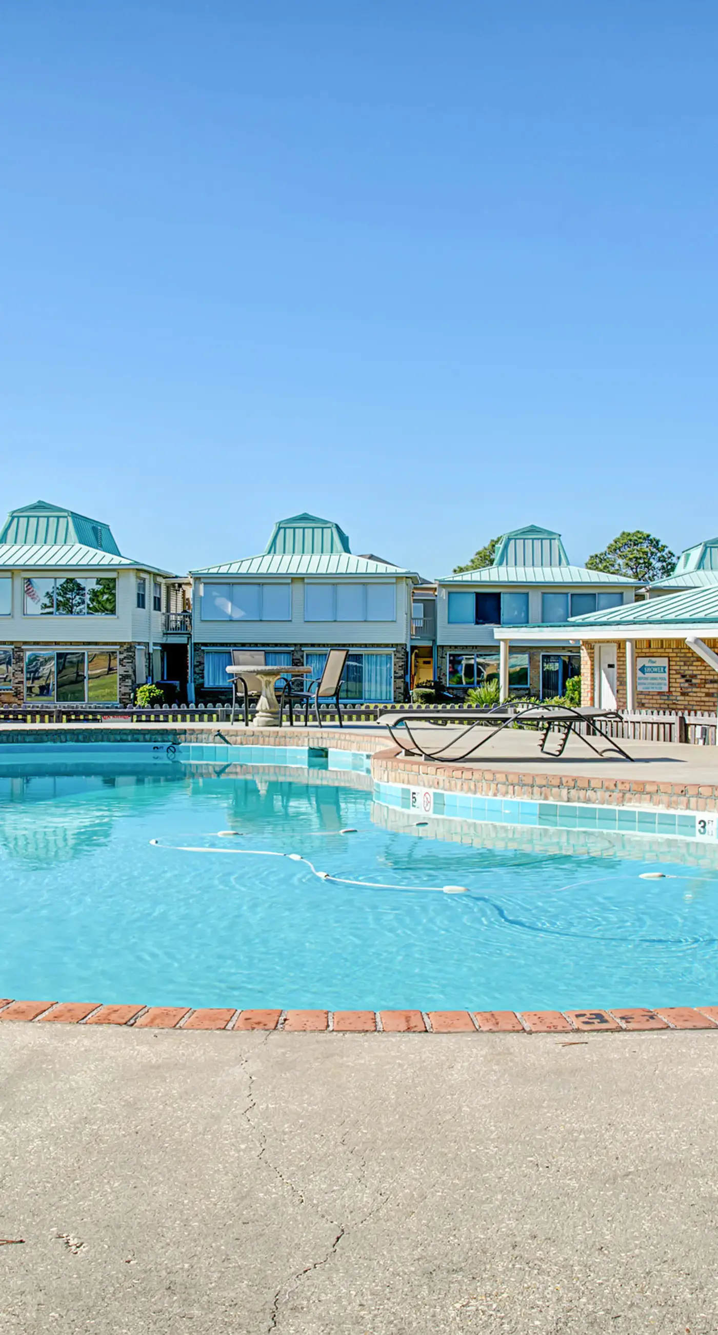 Family-friendly, beachfront getaway with a stainless kitchen & shared pool