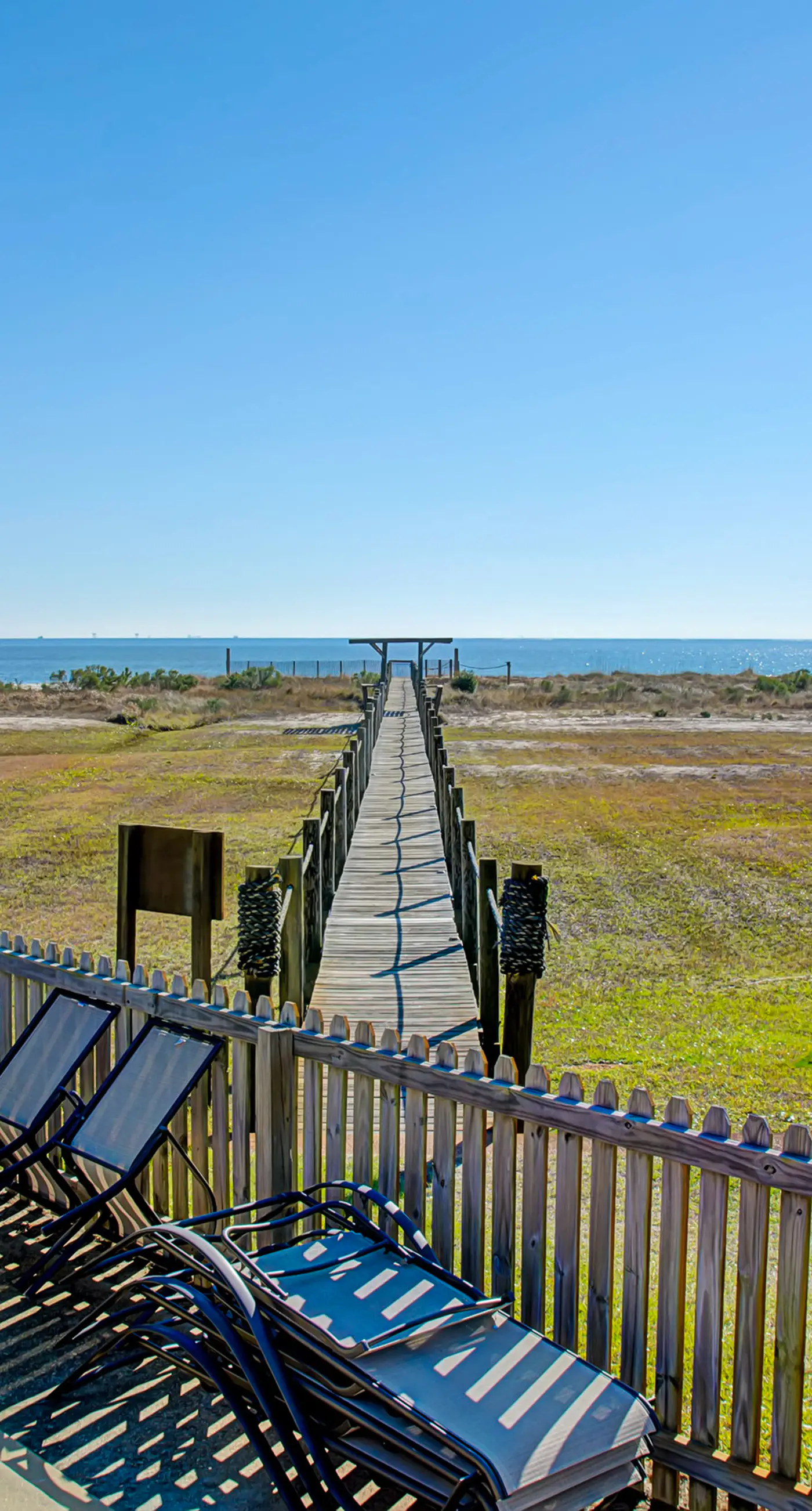 Family-friendly, beachfront getaway with a stainless kitchen & shared pool