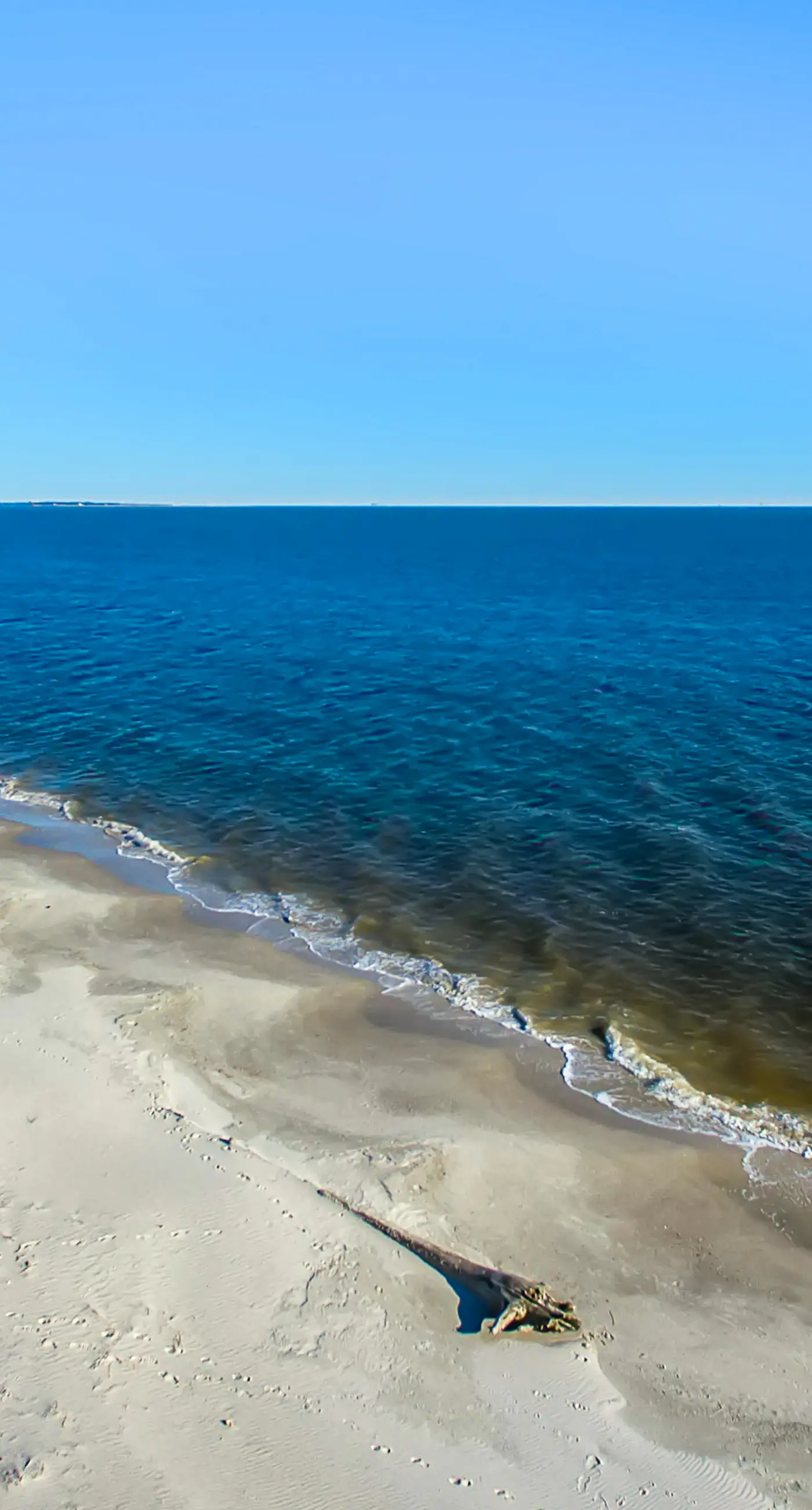 Family-friendly, beachfront getaway with a stainless kitchen & shared pool