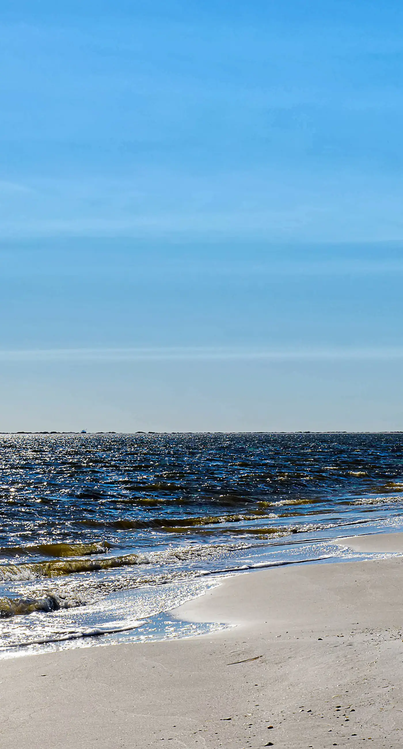 Family-friendly, beachfront getaway with a stainless kitchen & shared pool