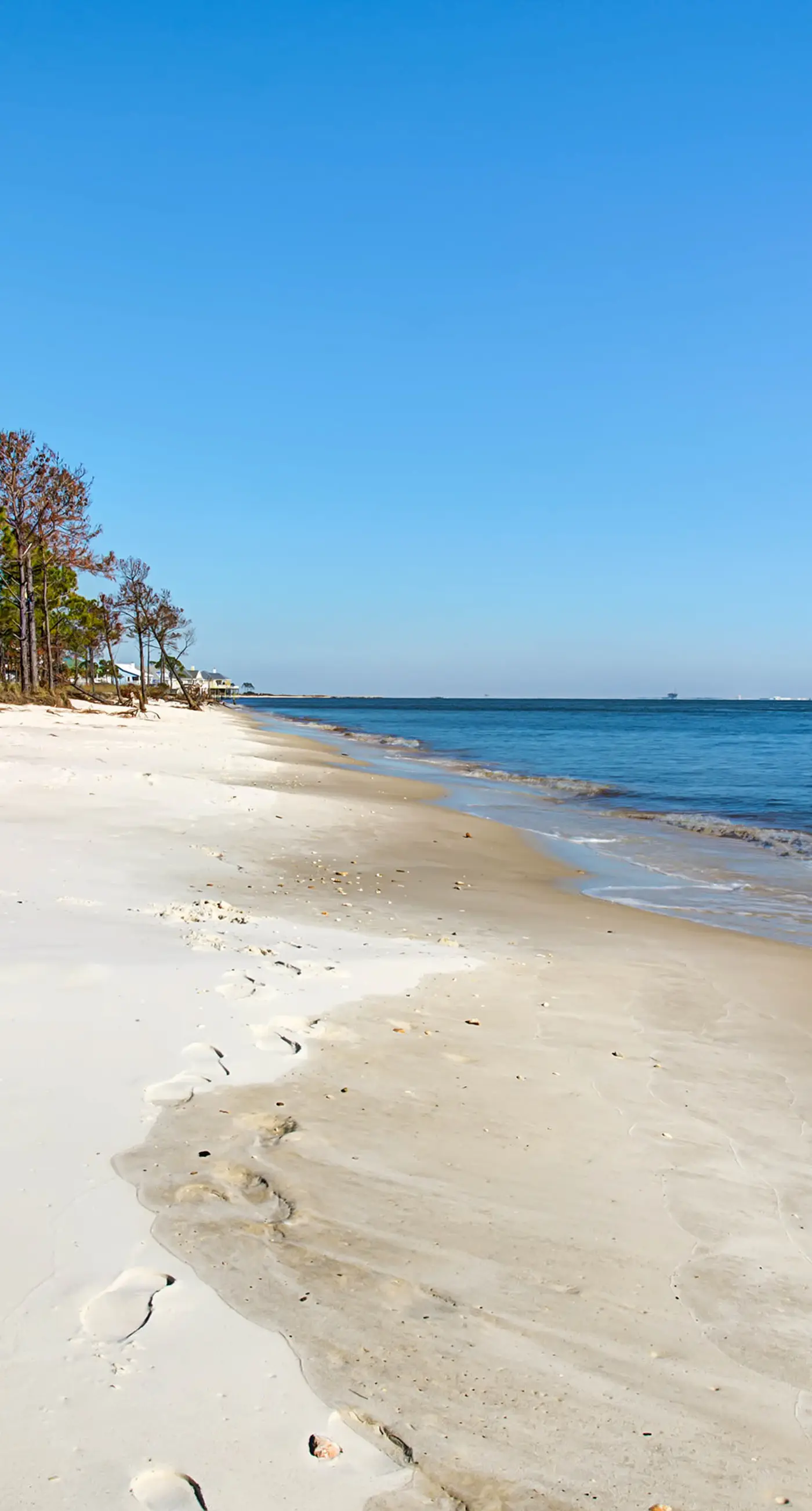 Family-friendly, beachfront getaway with a stainless kitchen & shared pool