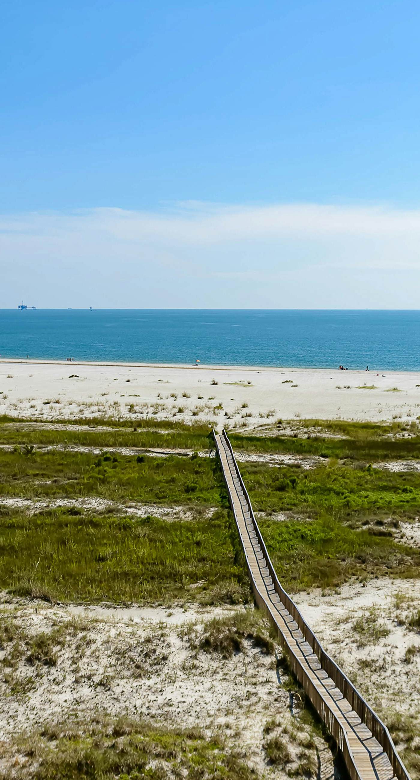 Bright & beachy waterfront condo with pools, tennis, gym, spacious balcony & W/D