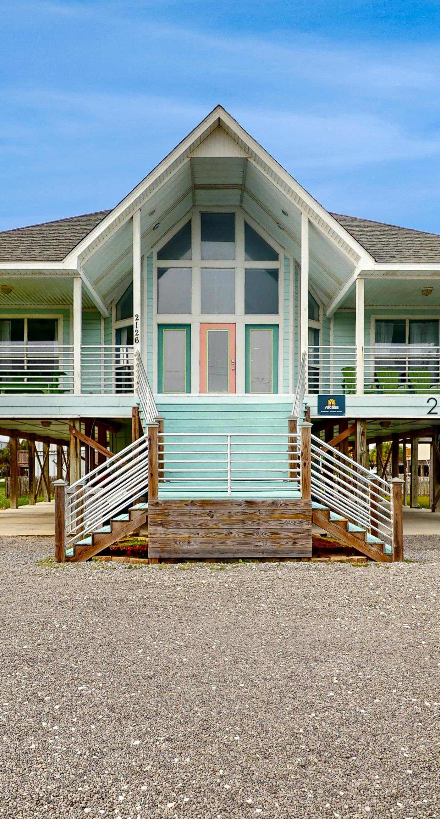 Two-story, dog-friendly home with partial ocean views, decks, private washer,dryer