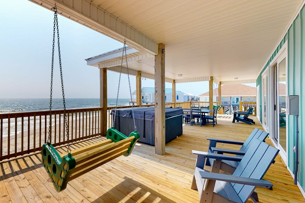 Exquisite oceanfront beach home with hot tub, central AC, balcony, & W&D