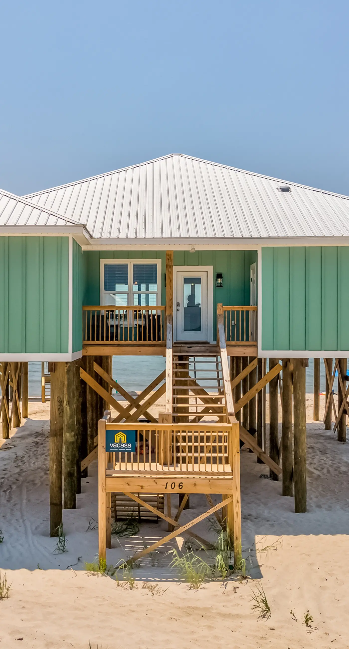 Exquisite oceanfront beach home with hot tub, central AC, balcony, & W&D