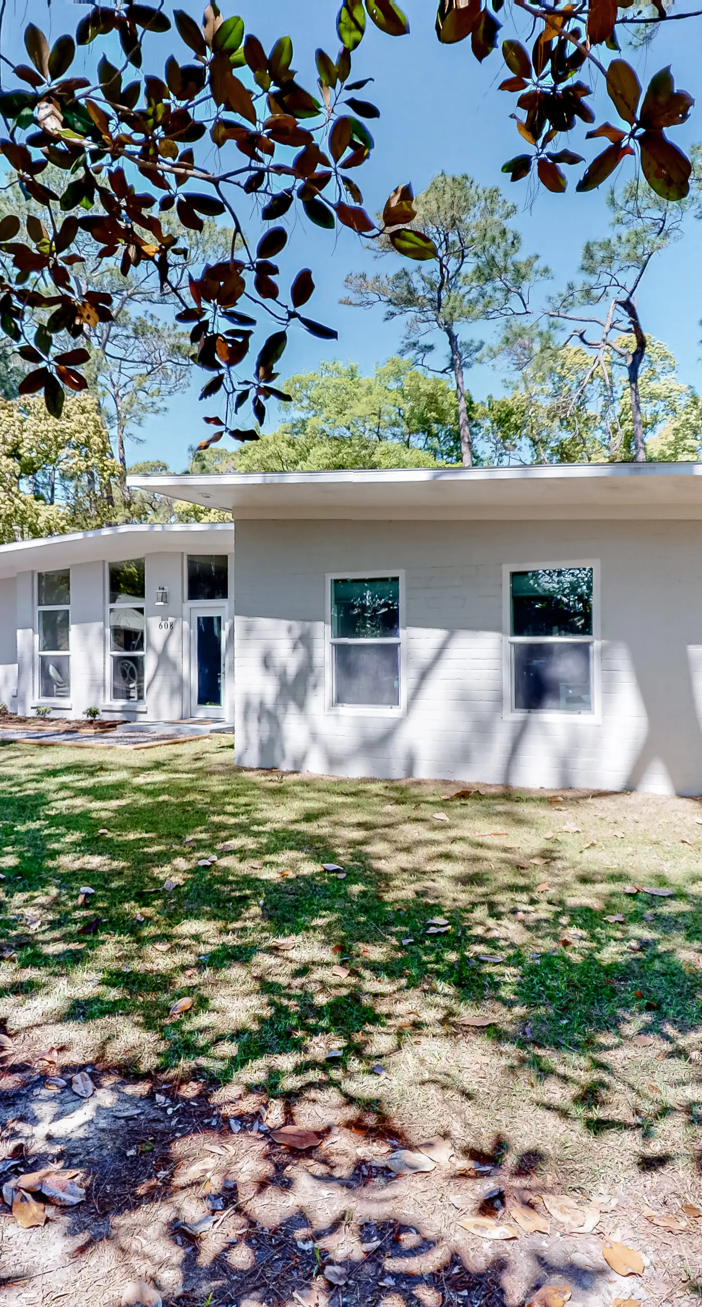 Modern dog-friendly home in the heart of island with hot tub & screened lanai