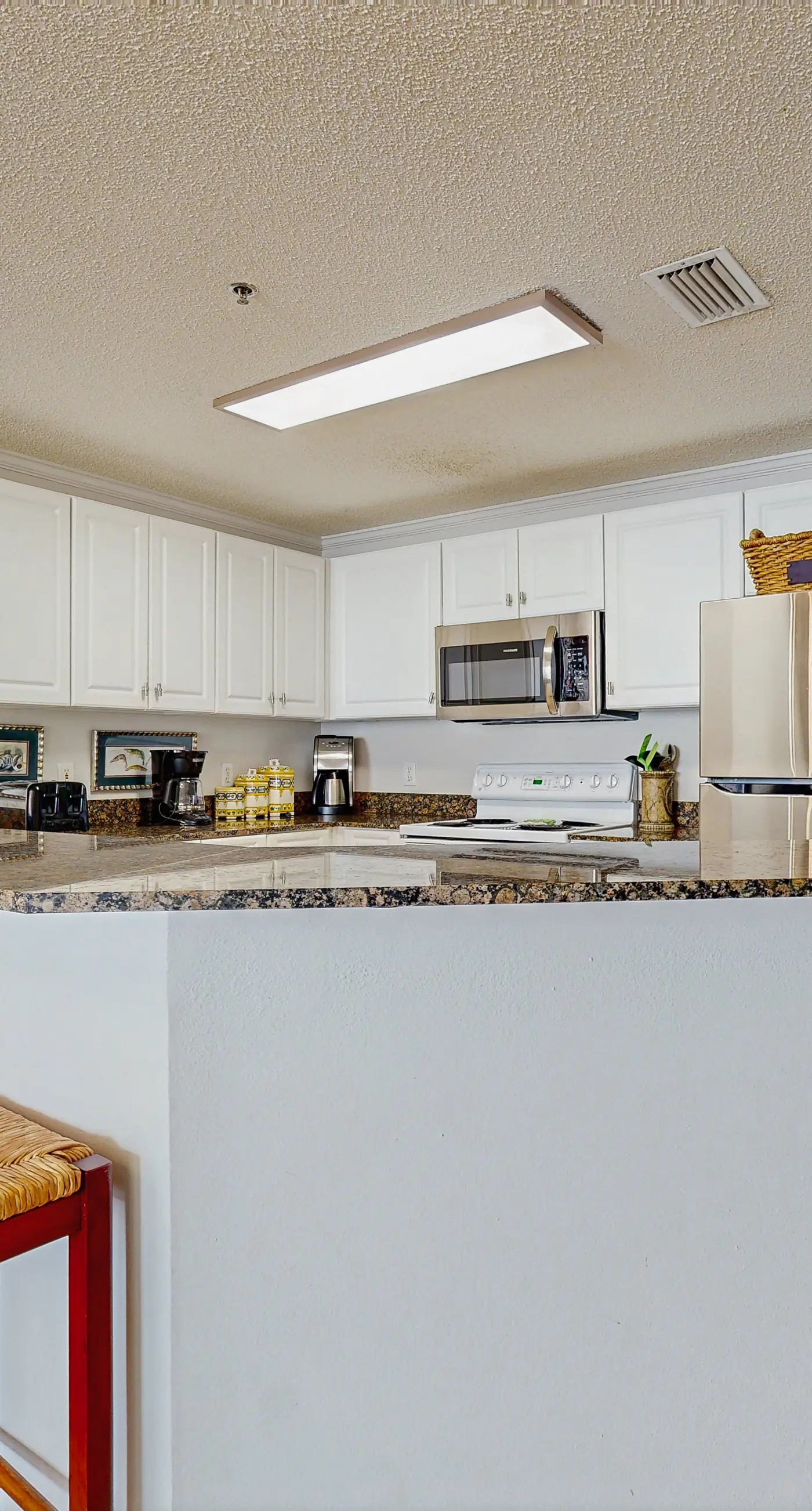 Spacious beachfront condo with full kitchen, shared pool and beach access