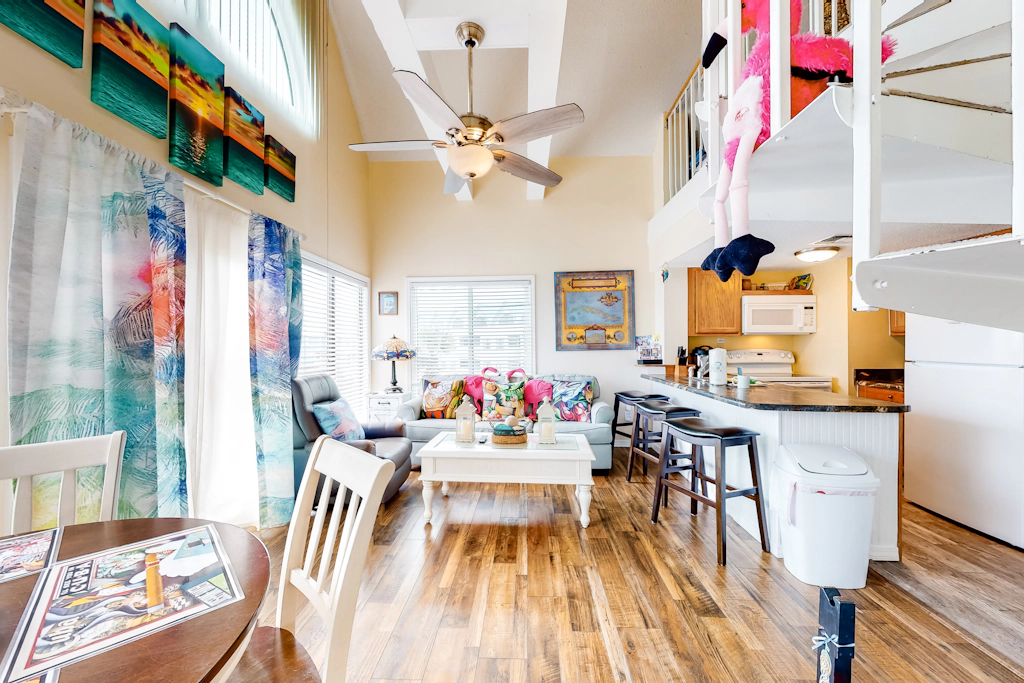 Colorful condo in beachfront complex with pools, gym, central AC & beach access